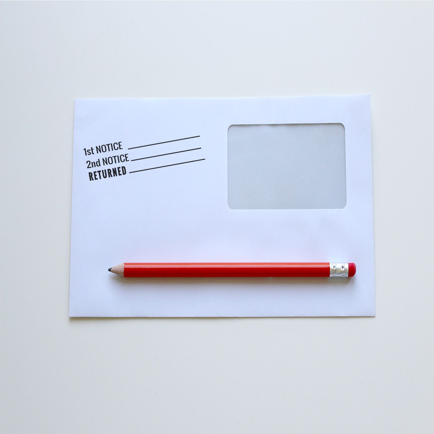 Notice paper with 1st NOTICE, 2nd NOTICE, RETURNED markings and blank label box, illustrating returned mail notification.