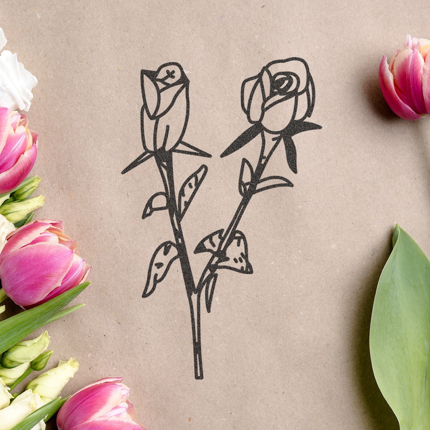 Minimalist rose line drawing on kraft paper surrounded by pink and white tulips, elegant floral design background.