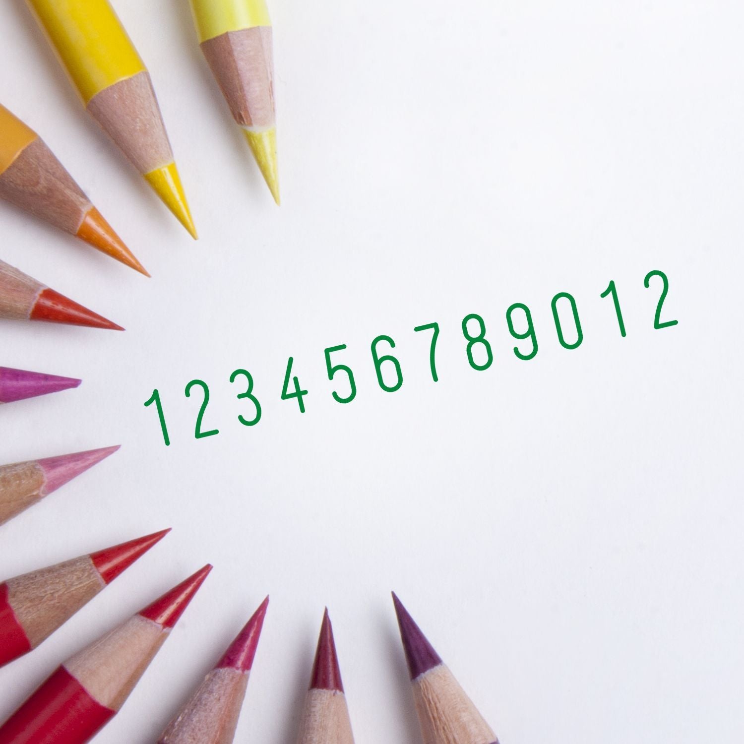 Color pencils with green numbers 123456789012 on white background for counting, math practice, and learning.