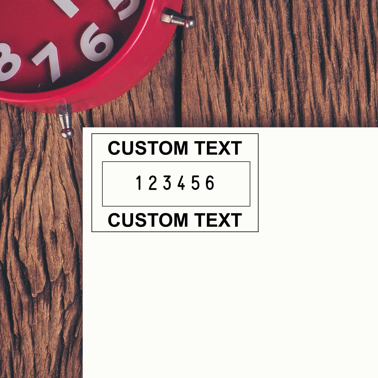 Red clock face and custom text card showing numbers 16 on rustic wooden background for personalization.