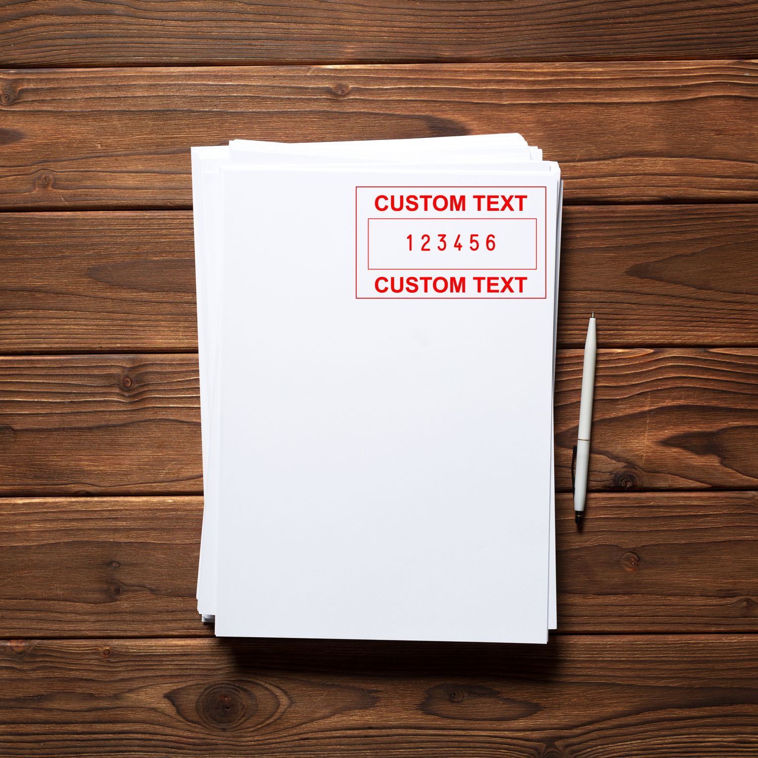 Stack of papers with printed CUSTOM TEXT and 1-6 fields on wooden desk, with pencustom label or stationery template