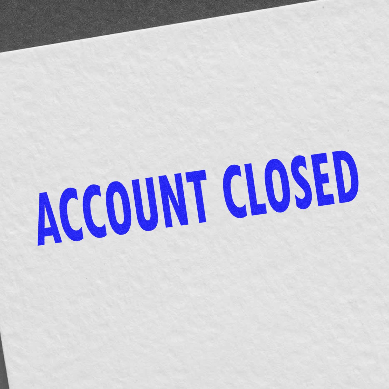 Account closed banner with blue ACCOUNT CLOSED text on a white paper background, notifying users their account has been closed.