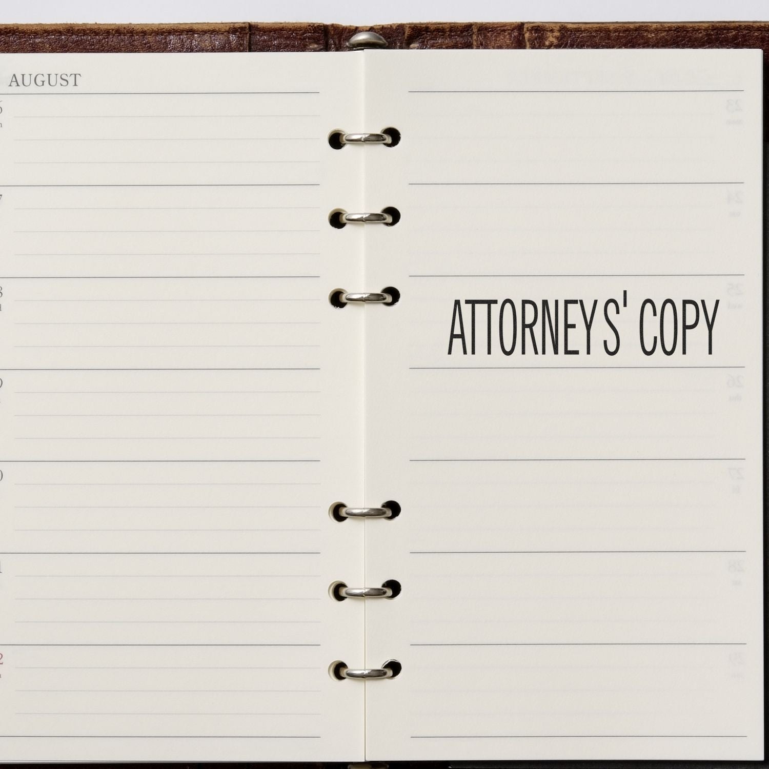 Open ring-bound planner page labeled August and Attorneys Copy with lined schedule sections.