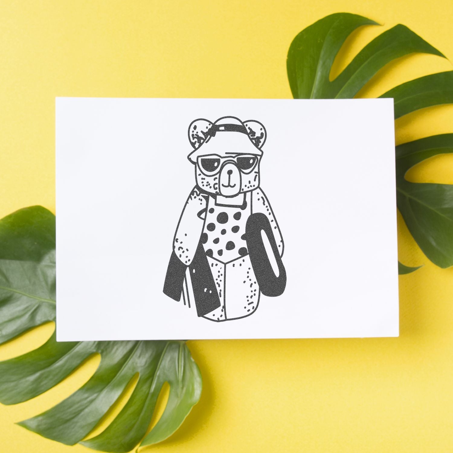 Cute bear illustration on a white card with tropical green leaves and yellow background, modern minimalist wall art print