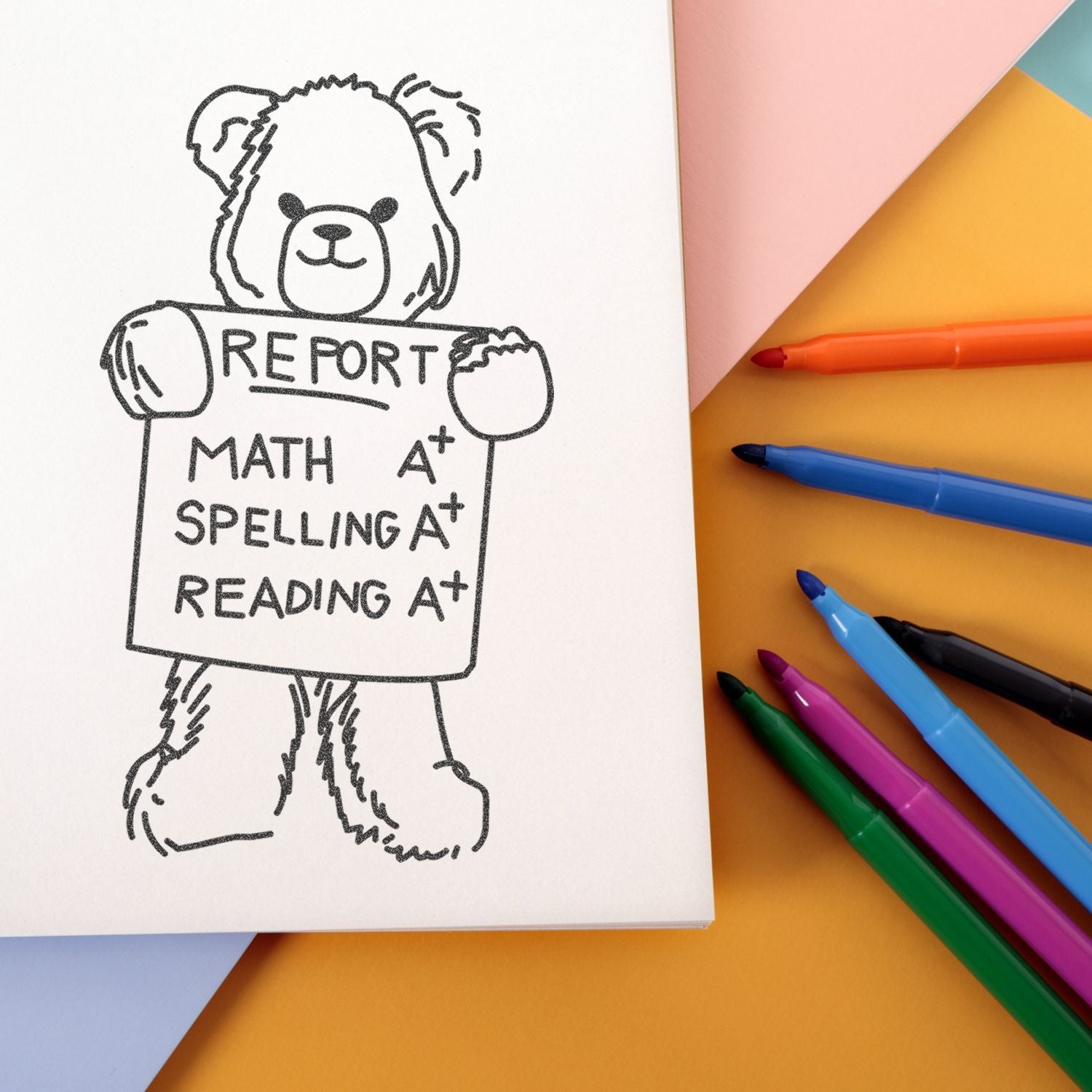 Cute teddy bear holding a report card with A+ grades for math, spelling, and reading, surrounded by colorful markers on pastel paper background.