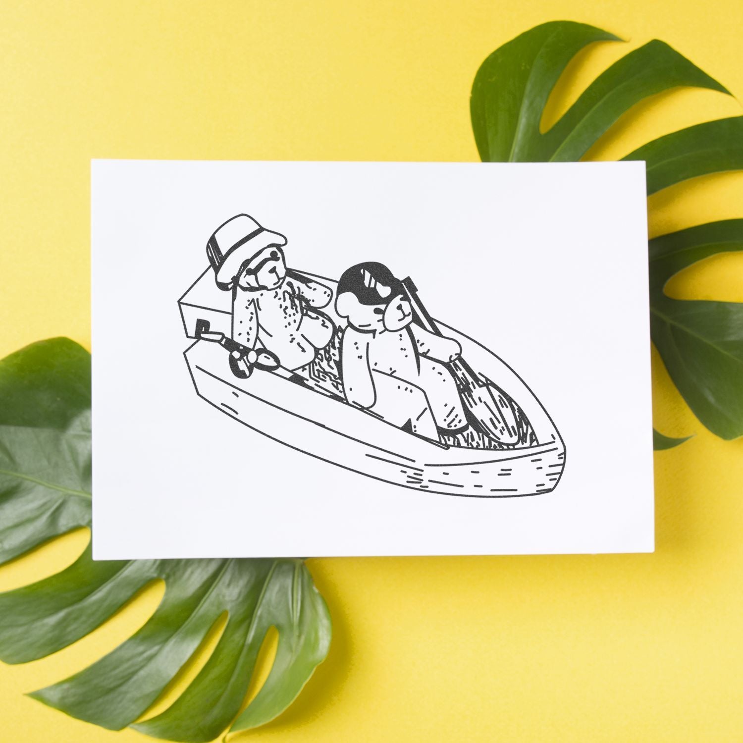 Black-and-white illustration of two dogs in a canoe on a white card with tropical leaves on a yellow background.