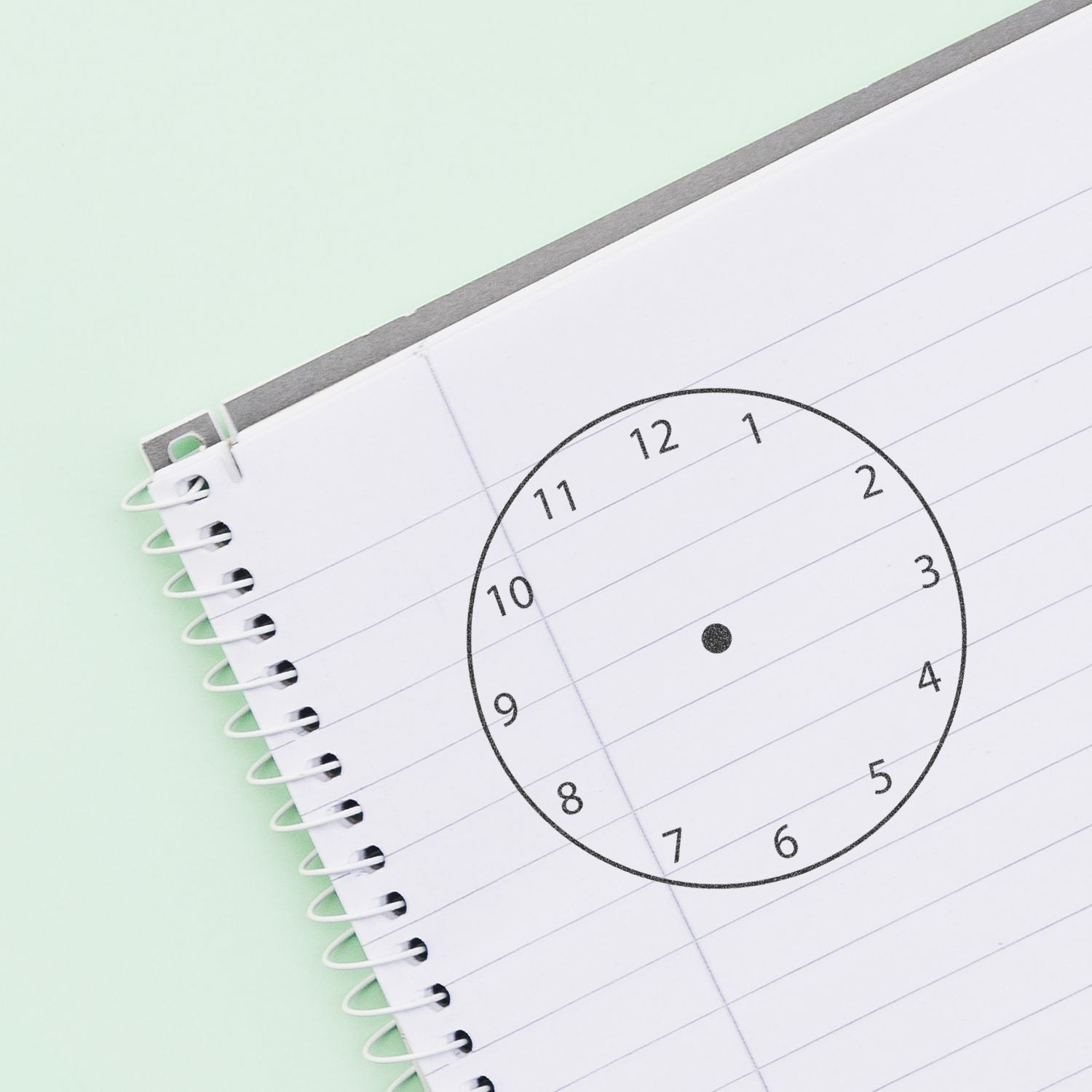 Spiral notebook page with hand-drawn clock face, time management and planning concept.