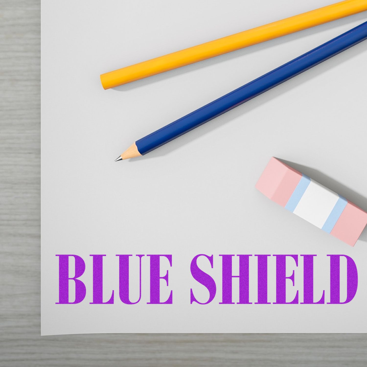 Blue Shield themed stationery photo with blue and yellow pencils, featuring the Blue Shield logo for insurance protection
