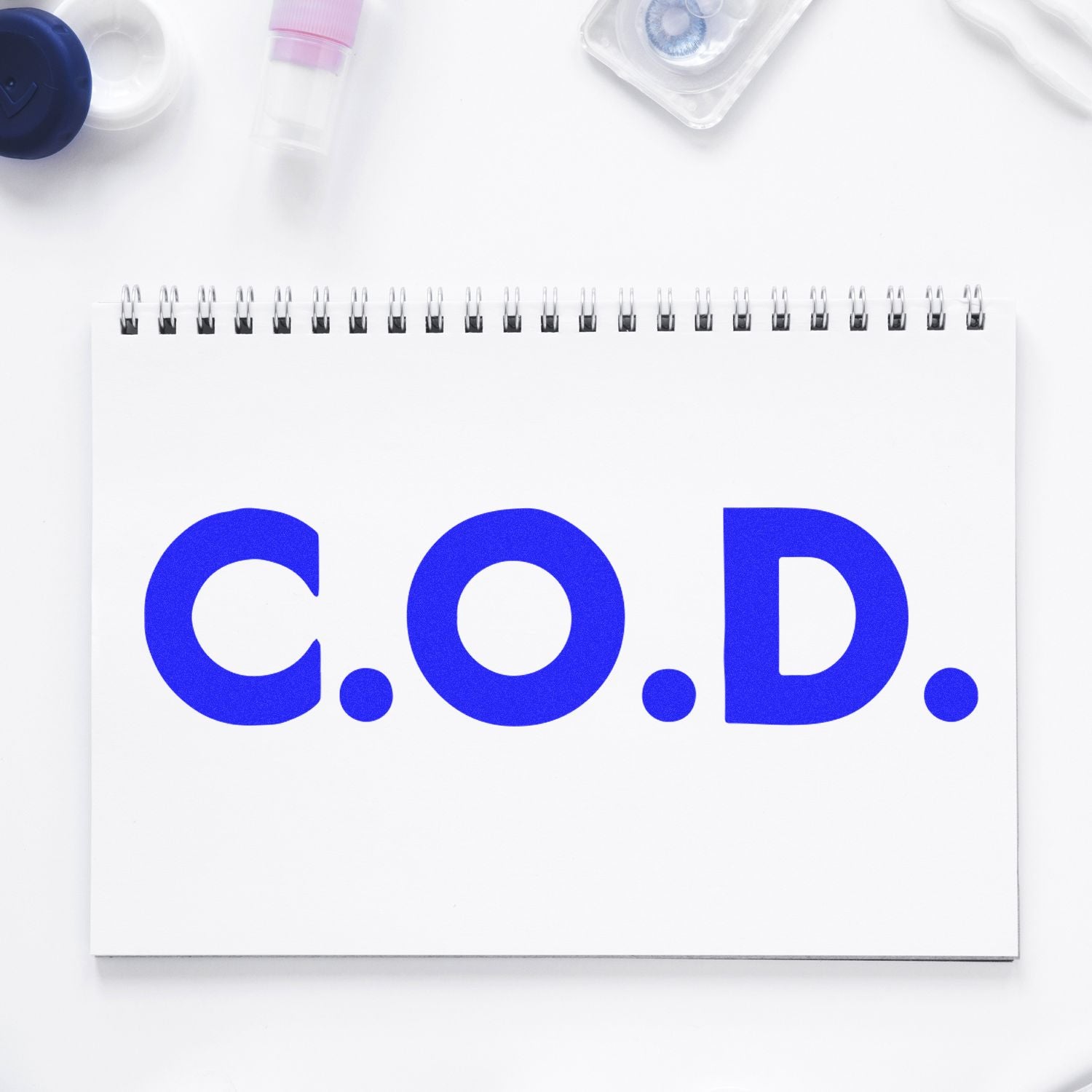 Chemical oxygen demand (COD) measurement notebook with lab reagents for environmental water quality testing on clean white desk.