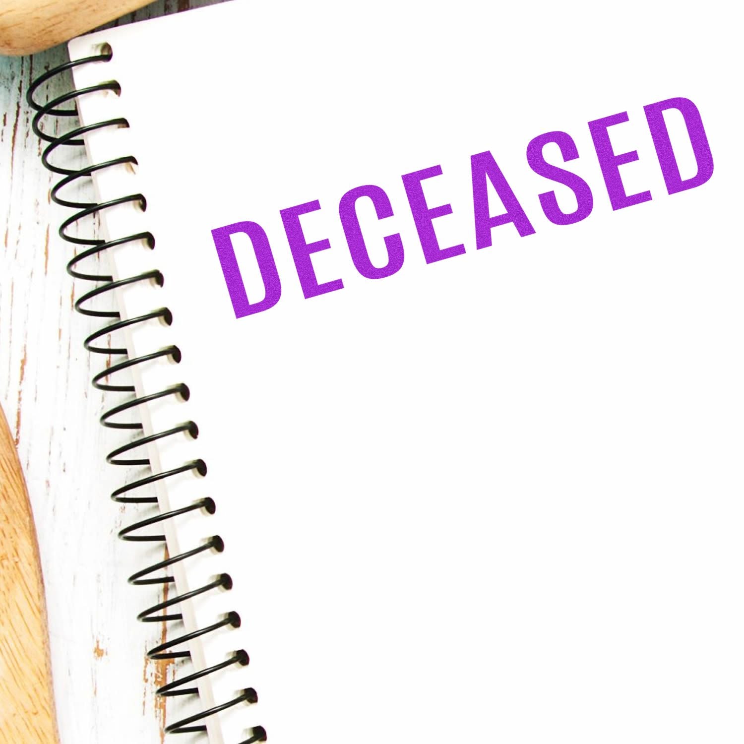 Spiral notebook with bold purple 'DECREASED' text, representing a lesson on reduction and lower results in data or finance.