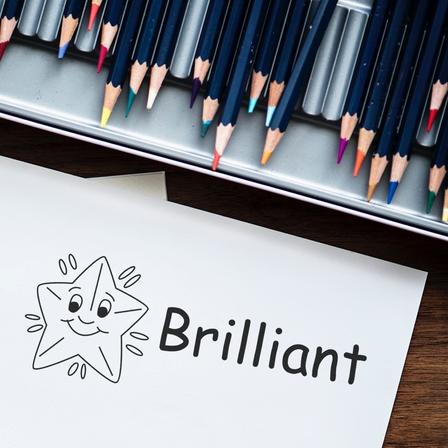 Color pencils and drawing paper showing a smiling star cat with Brilliant, highlighting creative art supplies and inspiration