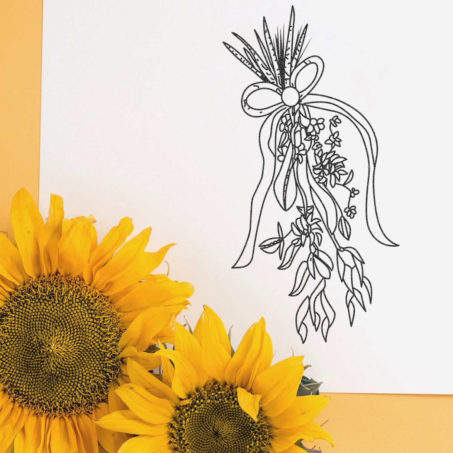 Bright sunflower blooms with minimalist black floral line art bow illustration on a white and yellow background.