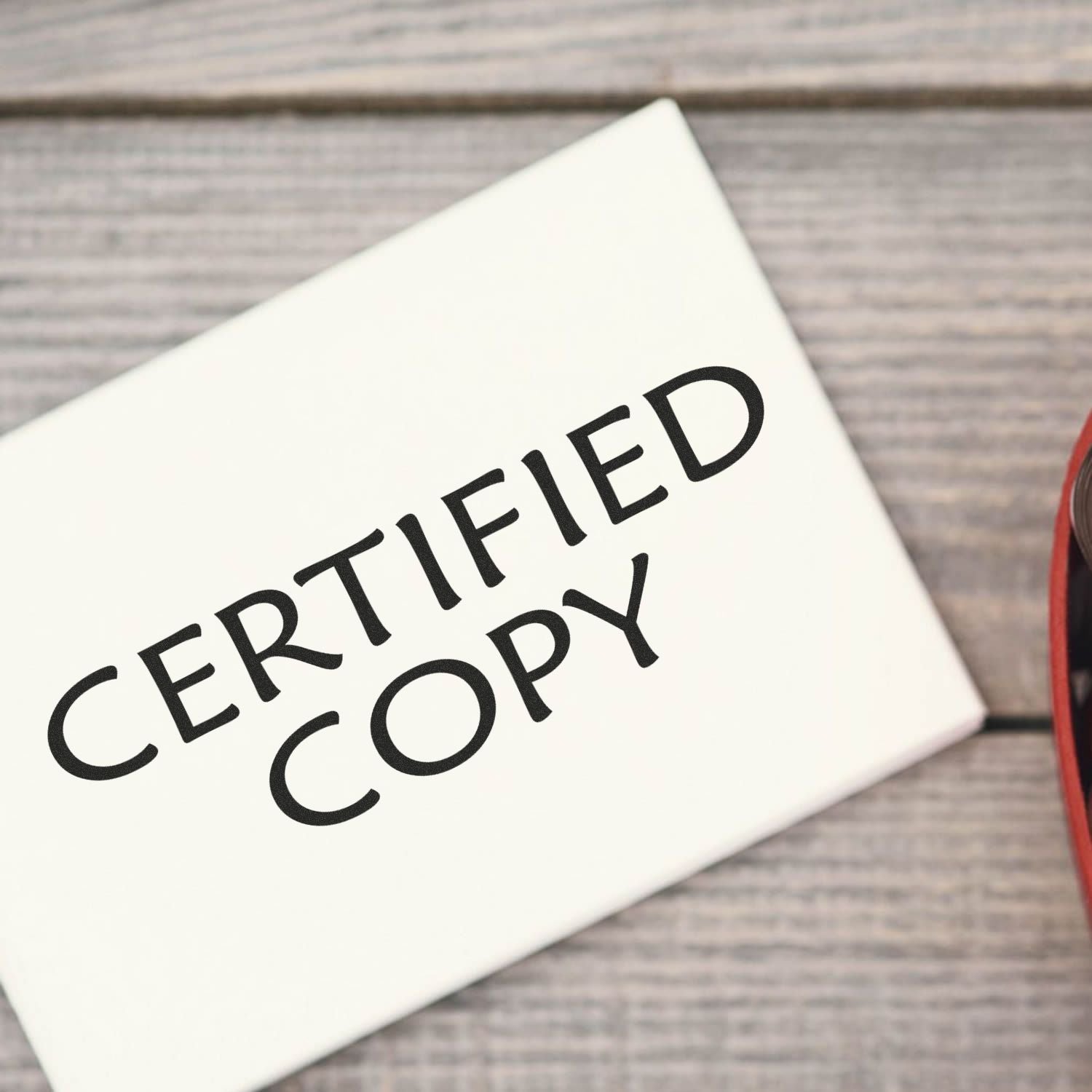 Close-up of a CERTIFIED label on a document, highlighting product certification, quality assurance, and compliance.