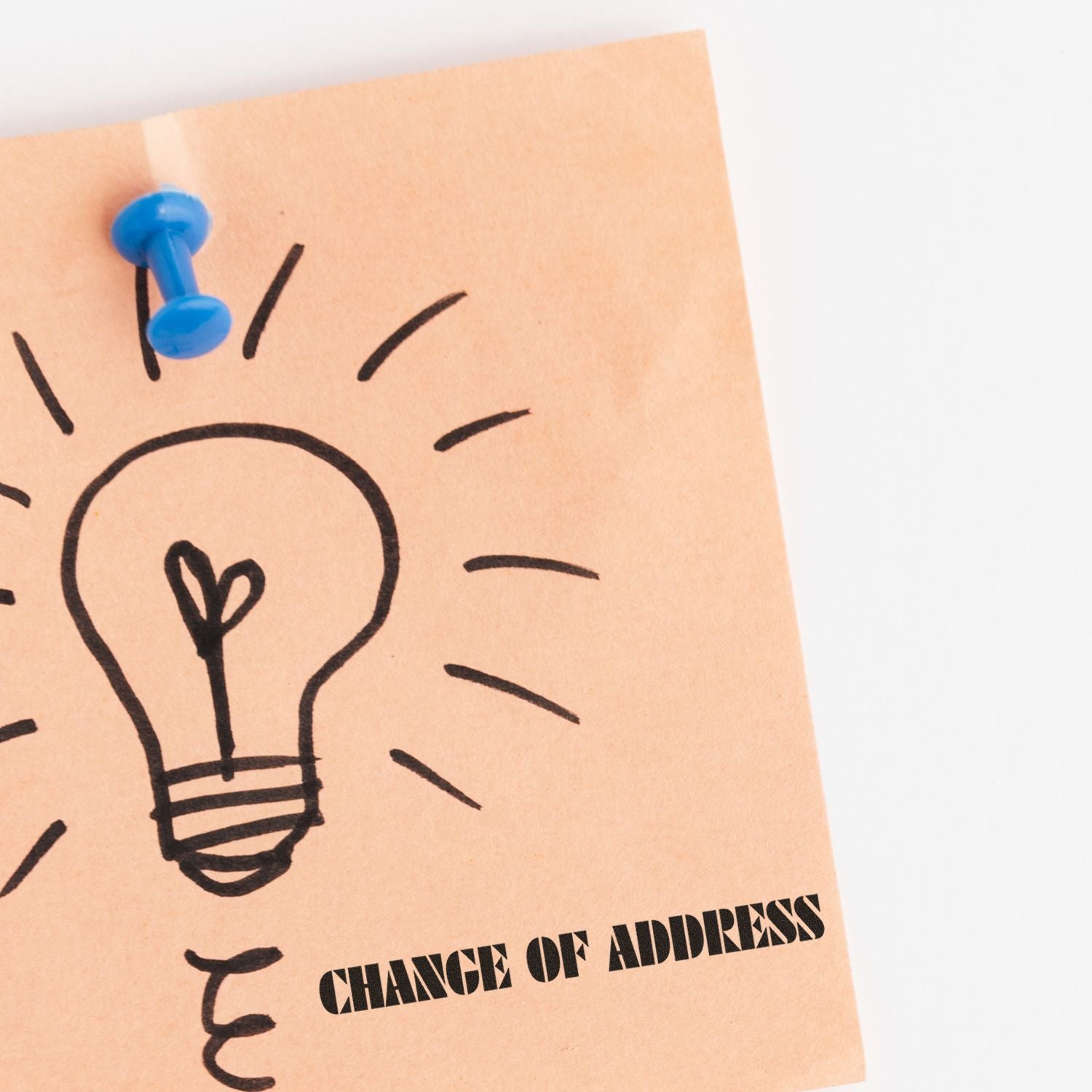 Pinned note reading Change of Address with light bulb icon, reminder for updating mailing details.