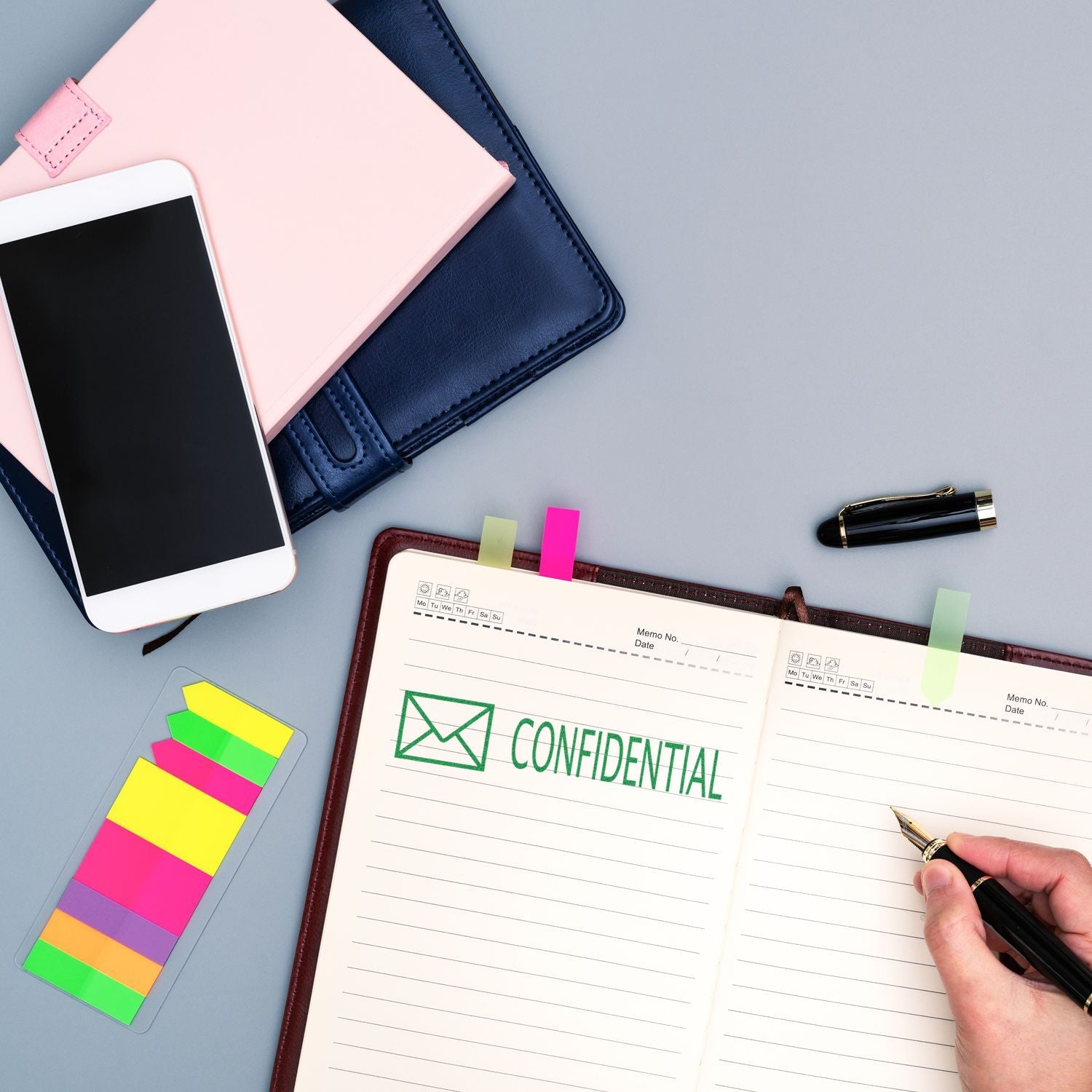 Confidentiality agreement note with pen writing on desk, smartphone and sticky notesNDA and data privacy concept.