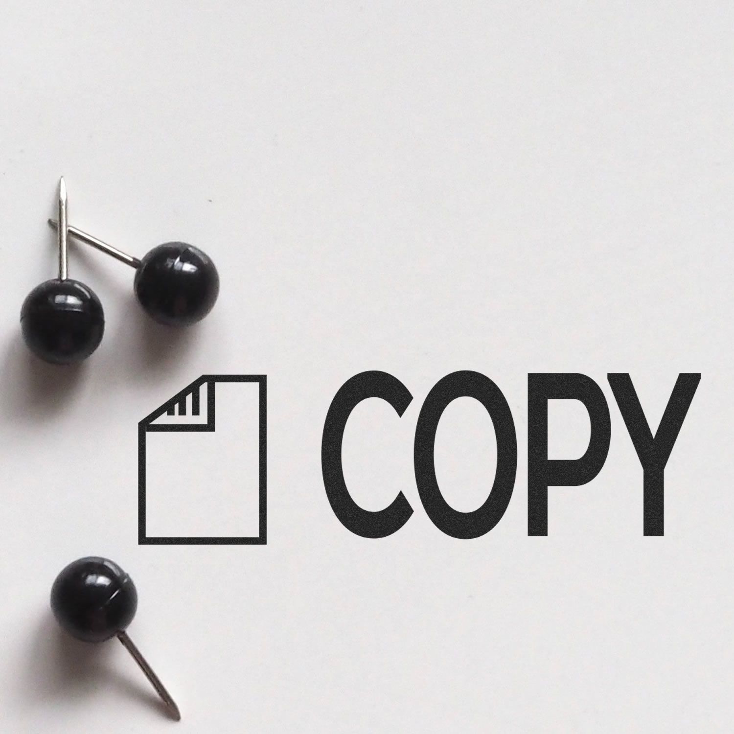 Black pushpins beside the word COPY, suggesting document copying and print-ready reproduction concept.