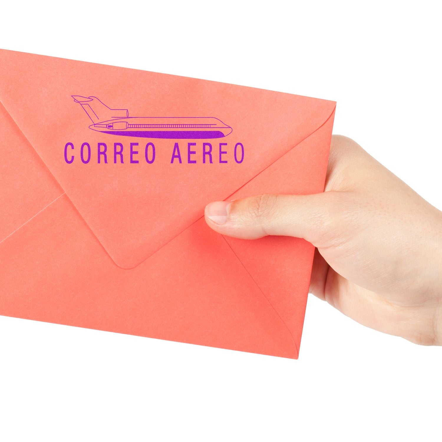 Hand holding red CORREO AEREO air mail envelope with airplane icon, indicating international shipping by air.