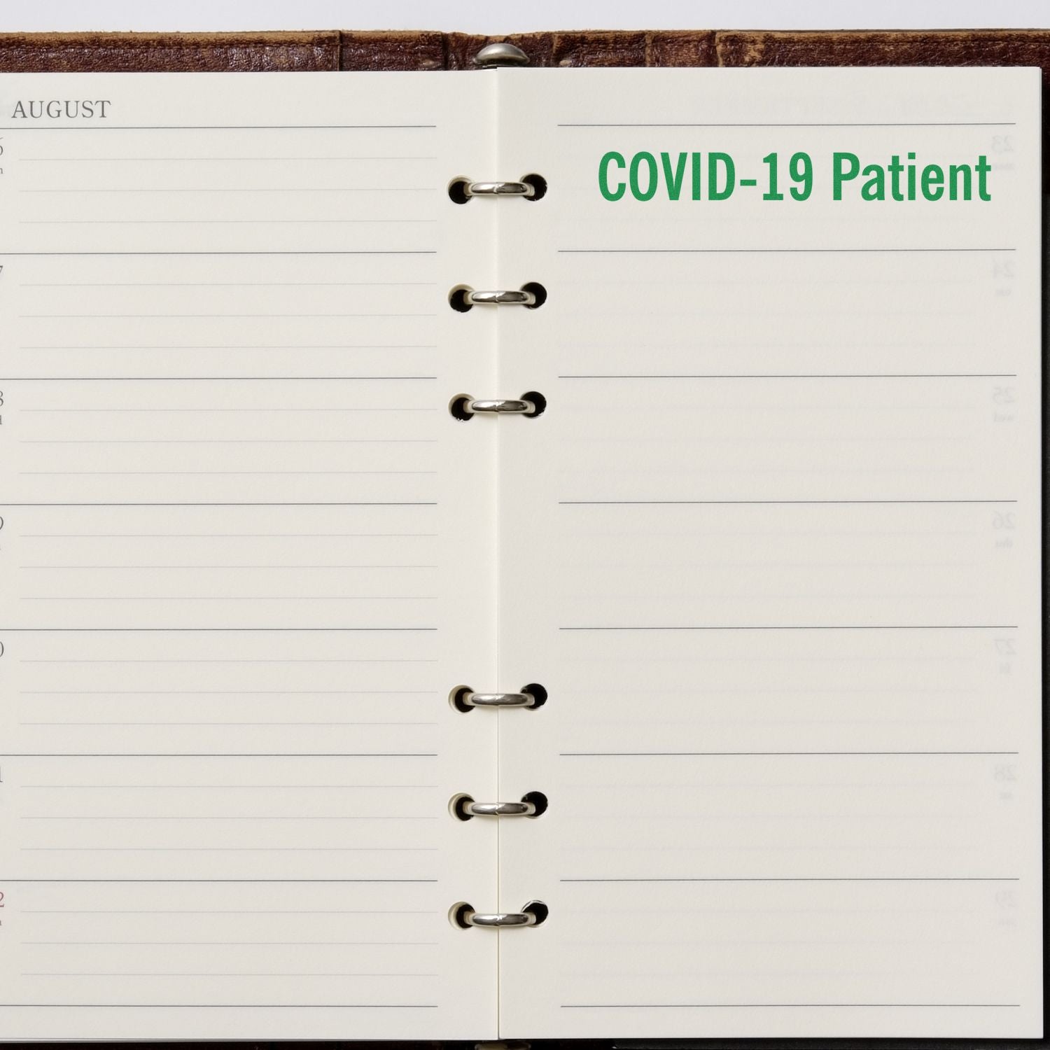 Open planner calendar page labeled COVID-19 Patient with blank August schedule and ring binding.