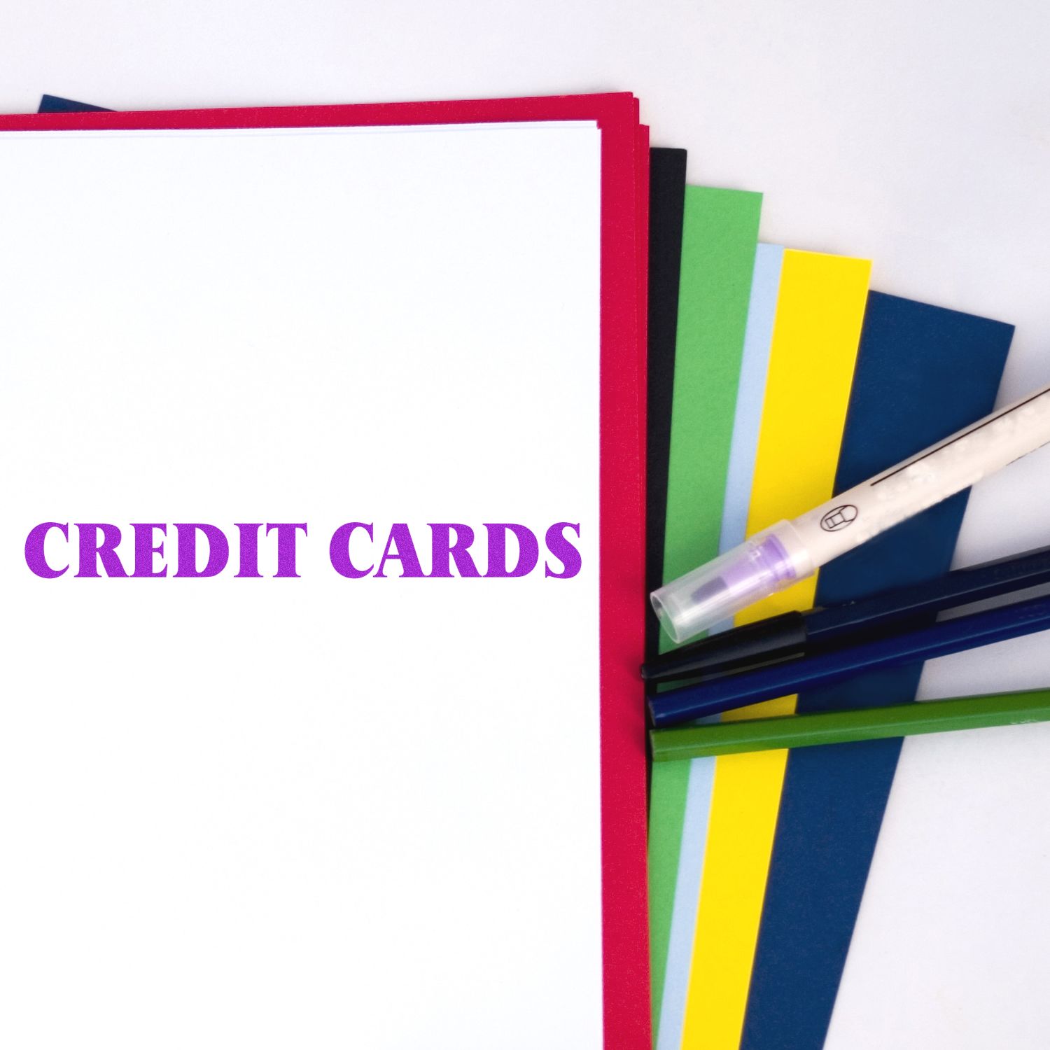 Credit cards concept with colorful file folders and highlighter, suggesting financial documents for personal budgeting and credit management.