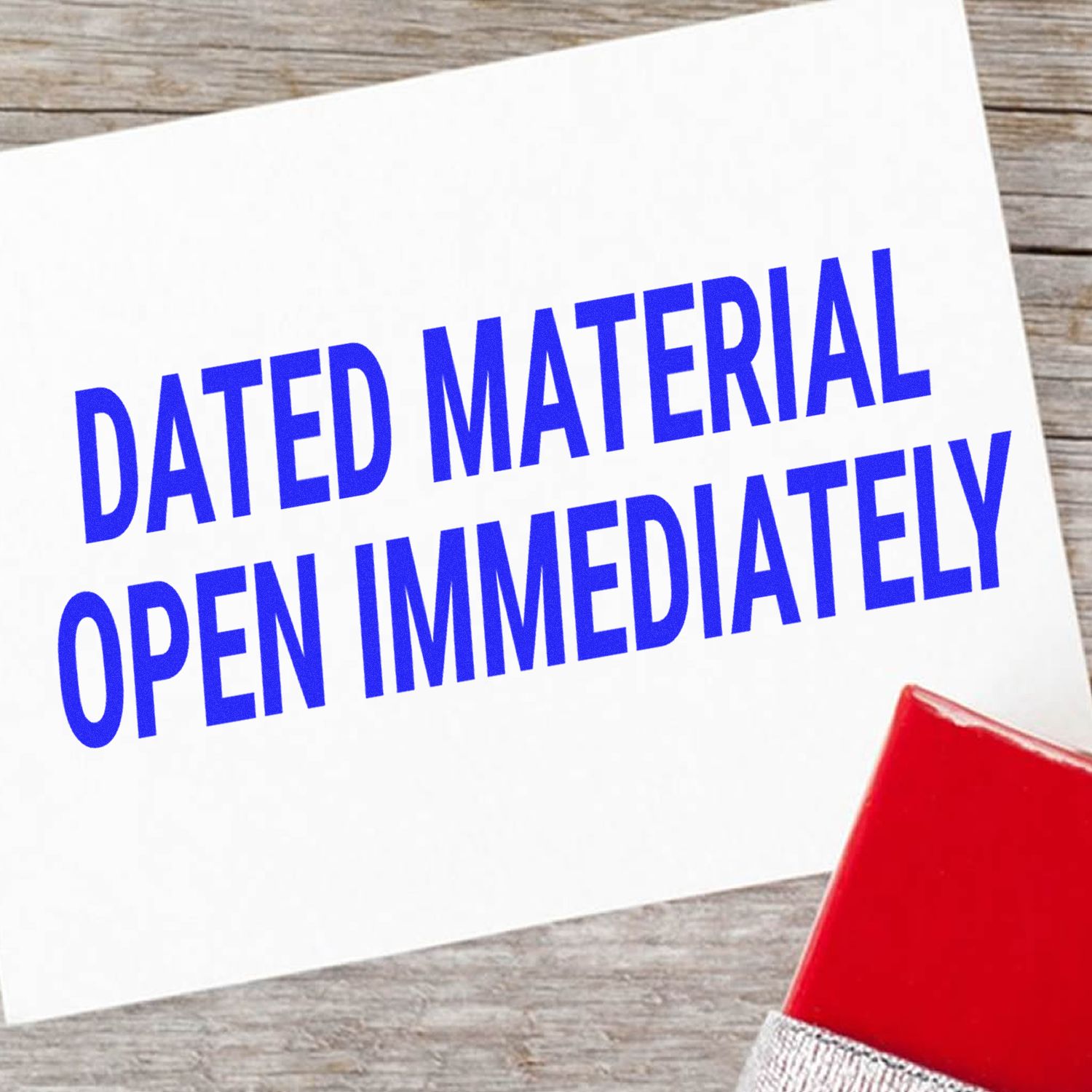 Dated MaterialOpen Immediately mail notice on white card with red envelope on wooden table, emphasizing urgent opening for delivery.
