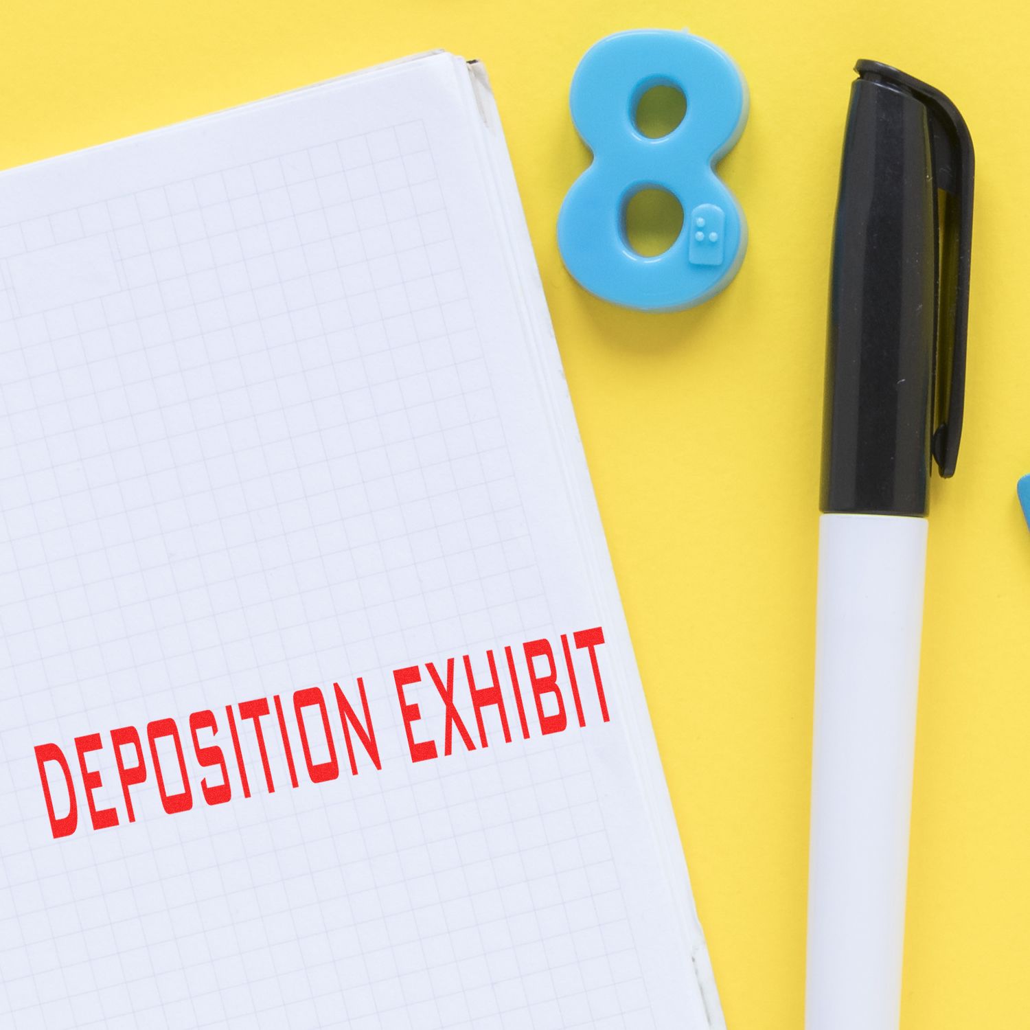 Deposition exhibit notebook with red title, numbered exhibit marker, and penlegal evidence labeling for court deposition exhibits.