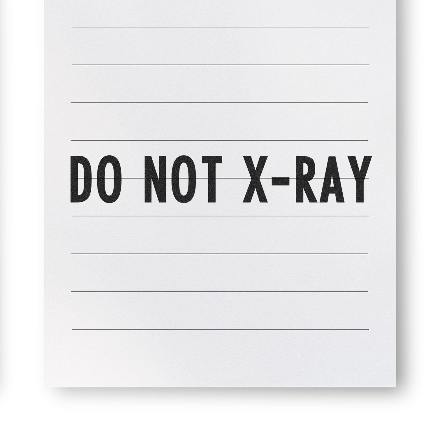 Warning label reading DO NOT X-RAY on a document, indicating items should not be X-rayed during screening.