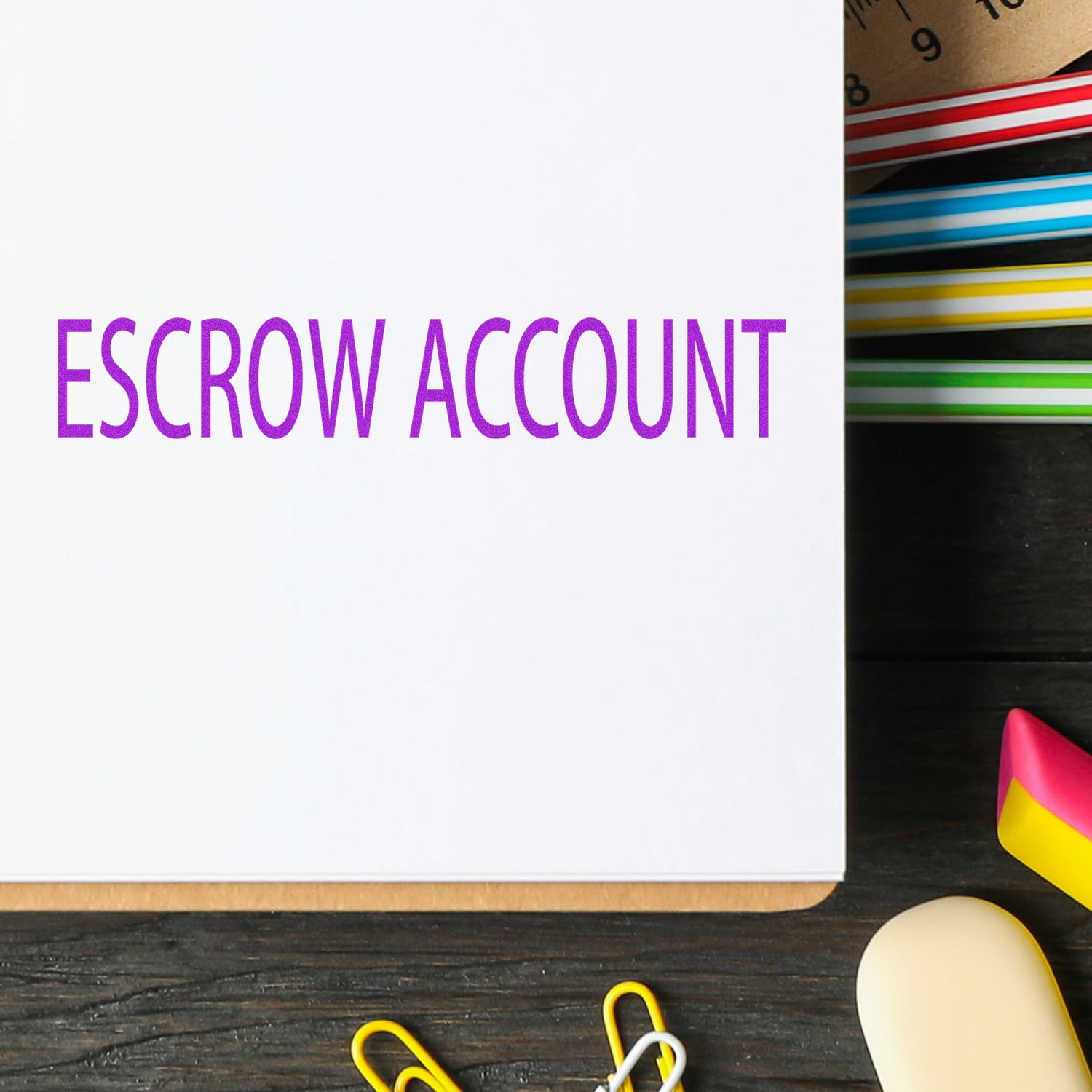 White document labeled ESCROW ACCOUNT with office supplies, highlighting secure escrow funding for real estate transactions