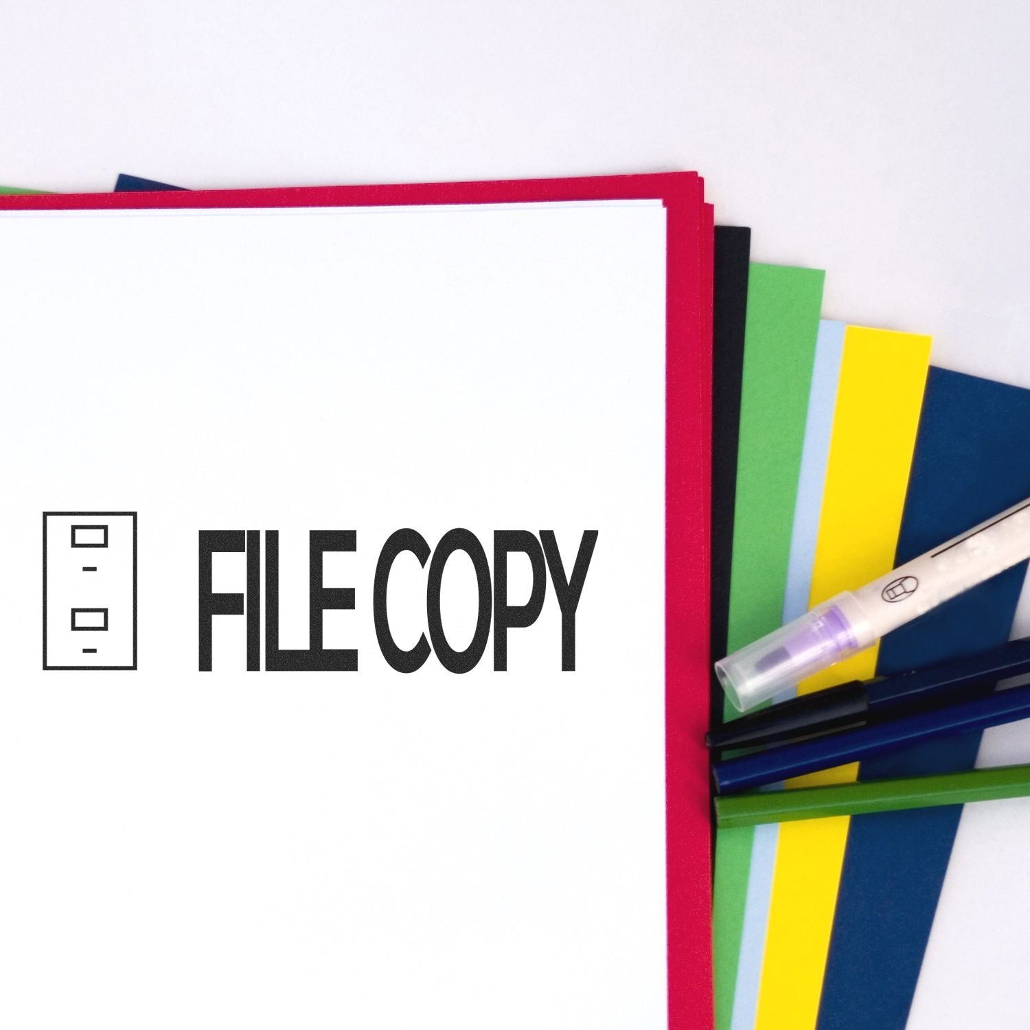 File copy folder with colorful dividers, pens, and office stationery on a white background.