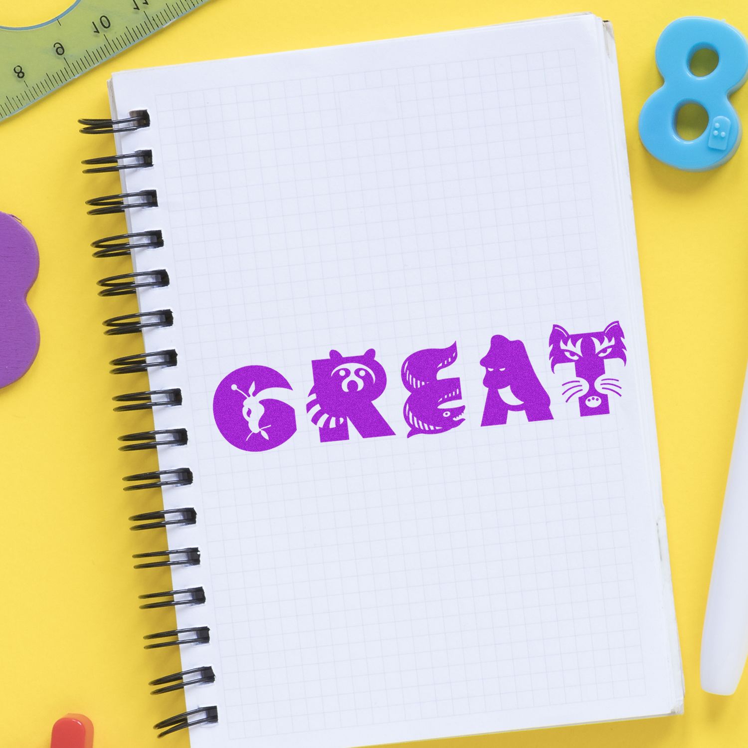 Colorful school supplies with a spiral notebook spelling GREAT in purple on a yellow background, ideal for back-to-school design.