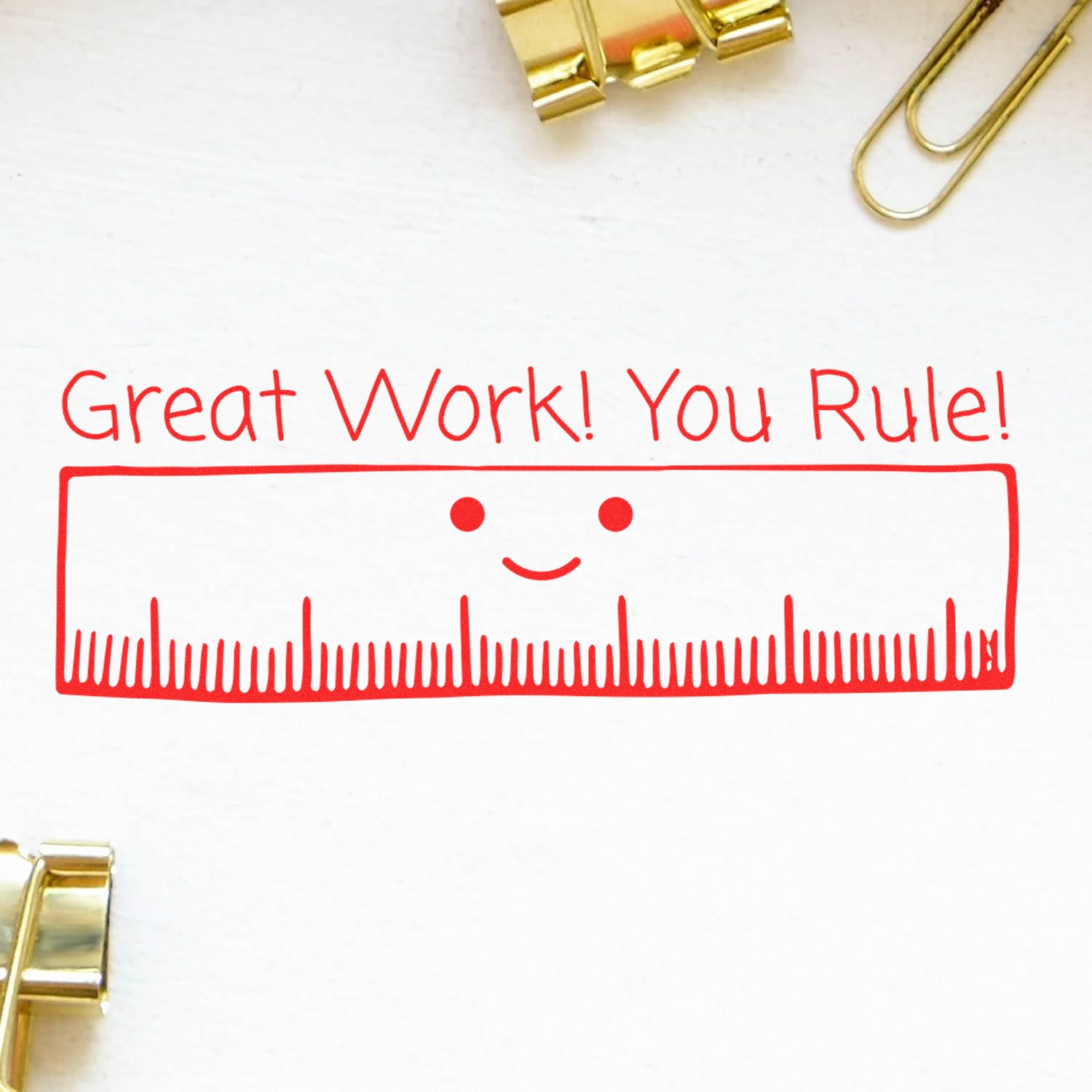 Red Great Work! You Rule! ruler illustration on white paper with gold paper clips, positive classroom reward design.