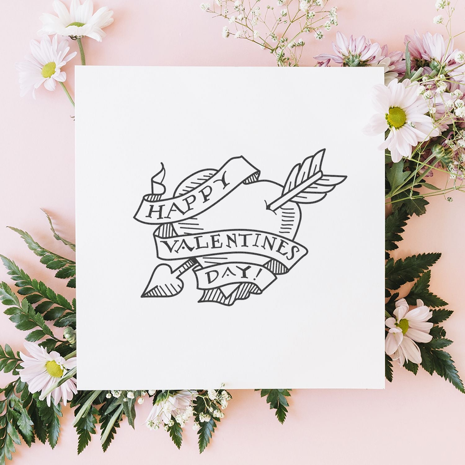 Happy Valentines Day card with hand-drawn heart and arrow design, surrounded by pink daisies and floral border on a pastel background.
