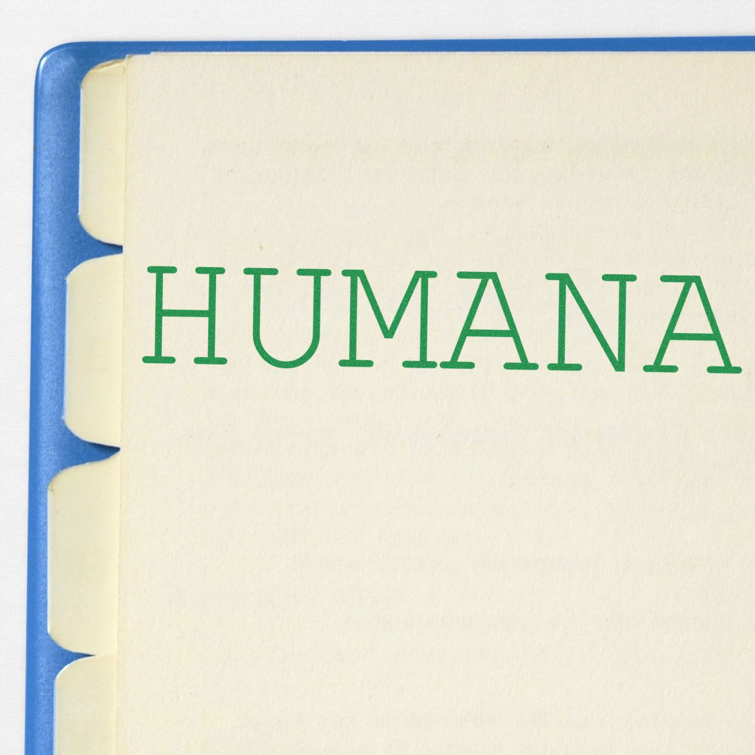 Humana logo in green letters on a notebook cover, representing Humana health insurance branding.