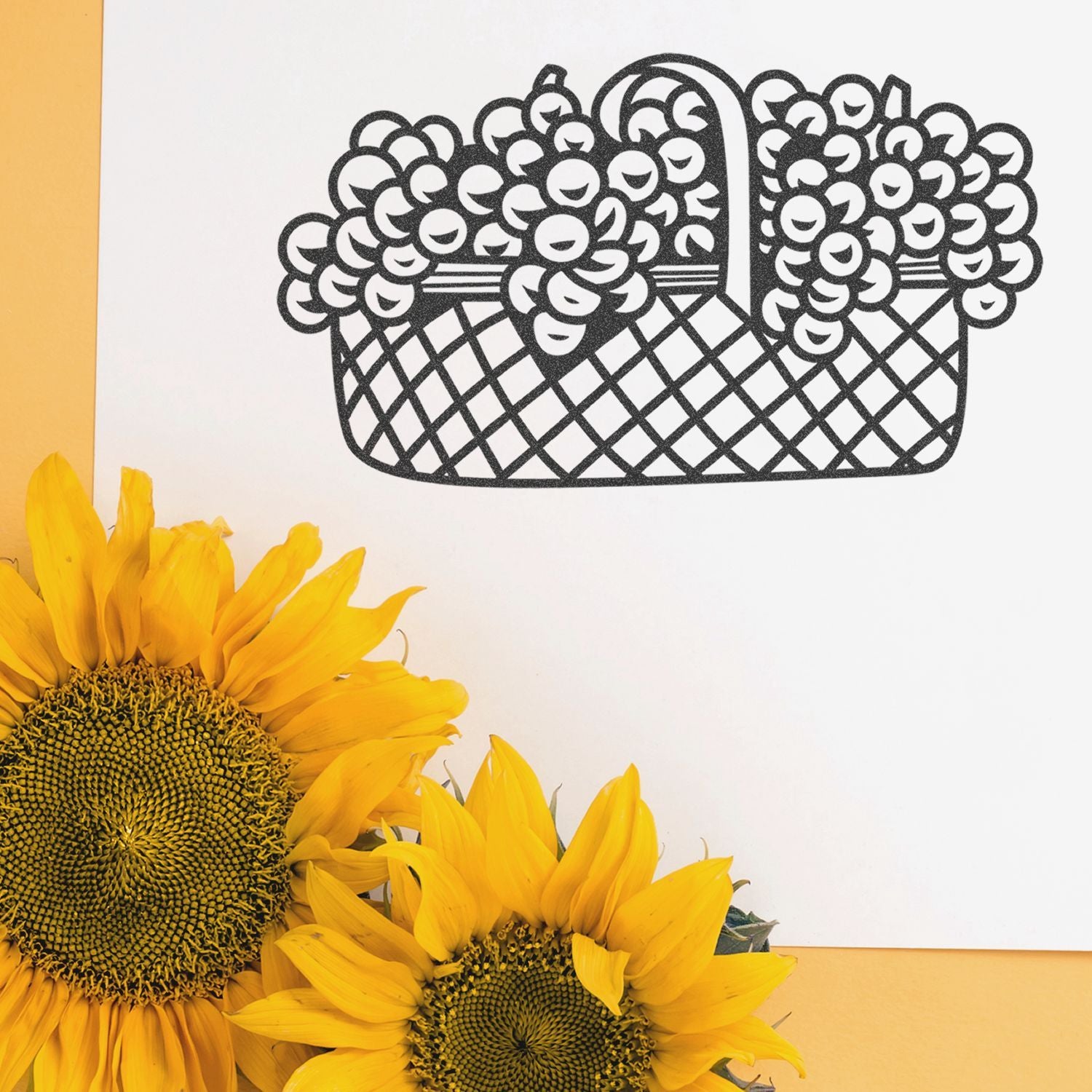 Bright sunflowers with a black floral basket illustration on a white and yellow background.