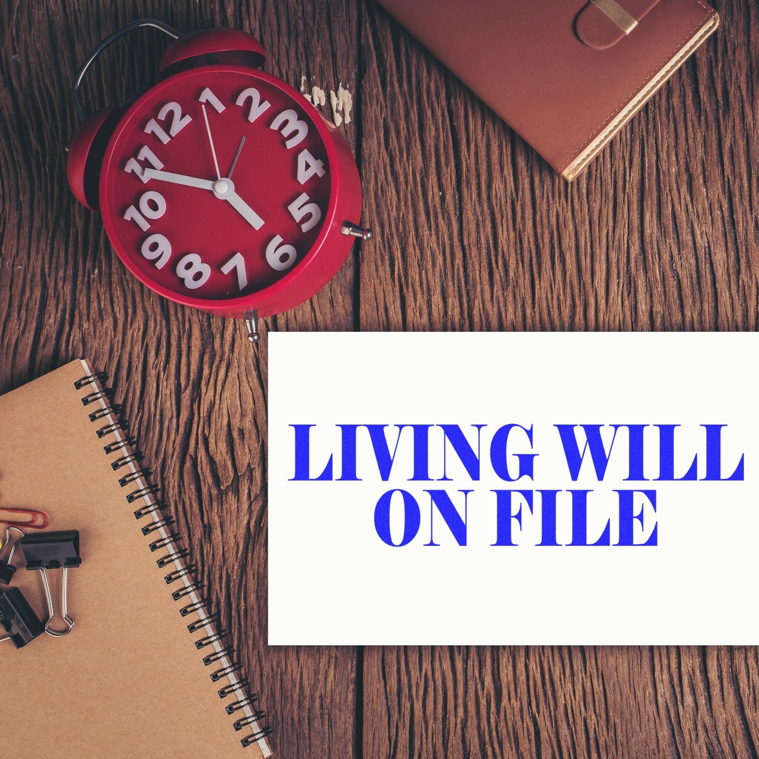 Red alarm clock, notebook, and wallet on desk with LIVING WELL ON FILE message promoting healthy routines and time management.