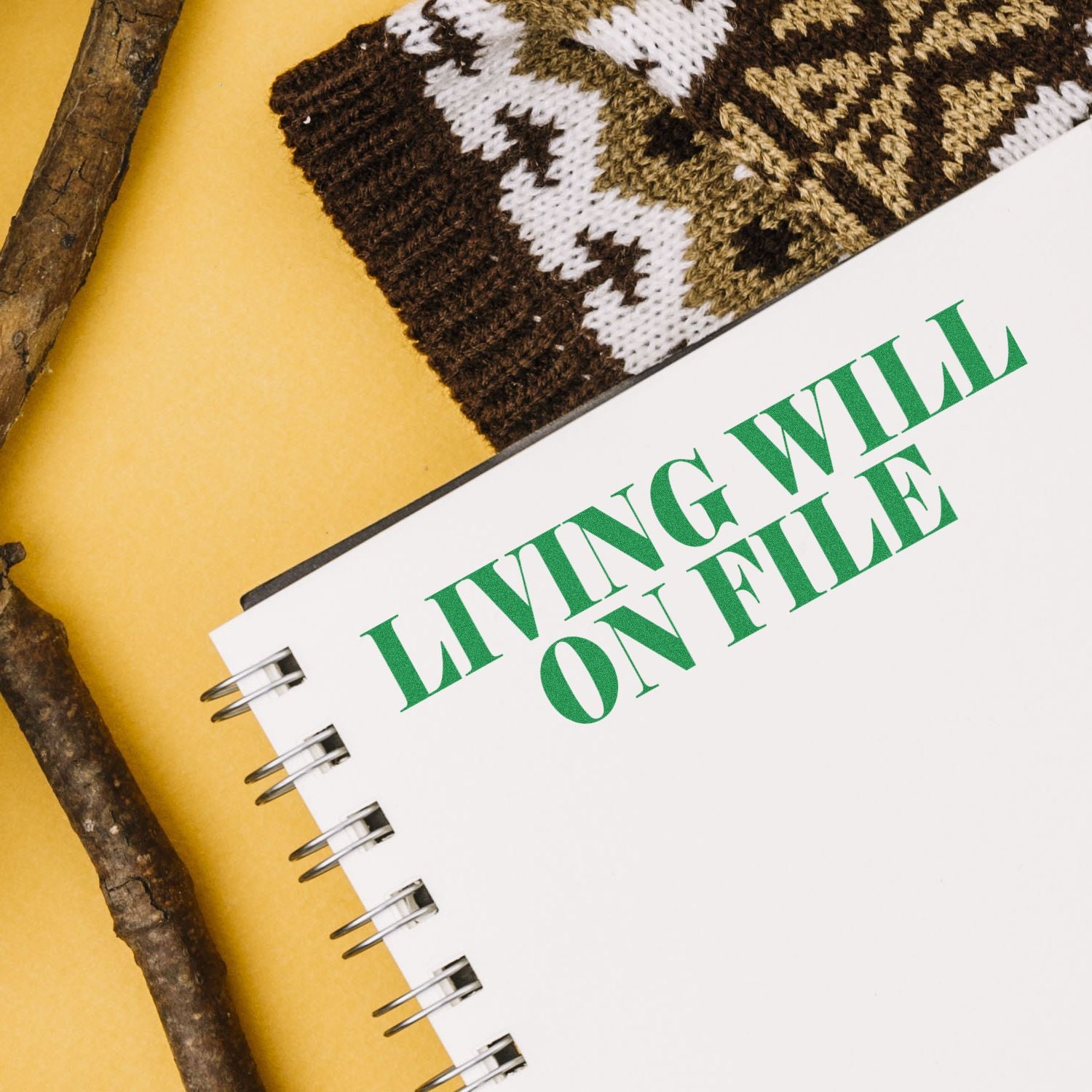Close-up of handmade notebook labeled LAWN with green typography and stitched fabric cover for gardening brand promotion.