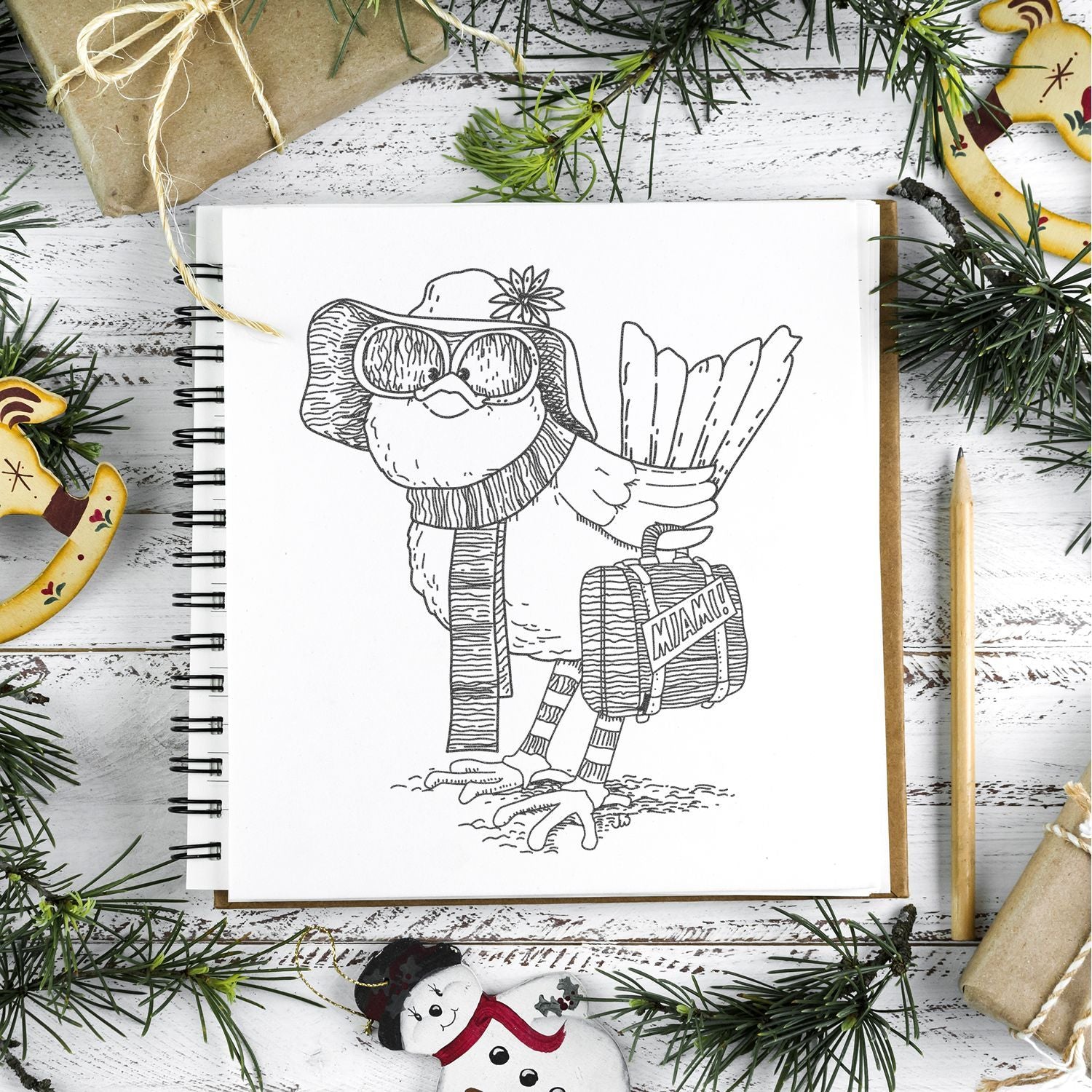 Holiday sketchbook illustration of a bird in sunglasses and hat carrying a Miami suitcase, surrounded by Christmas decorations and gift wrap supplies.