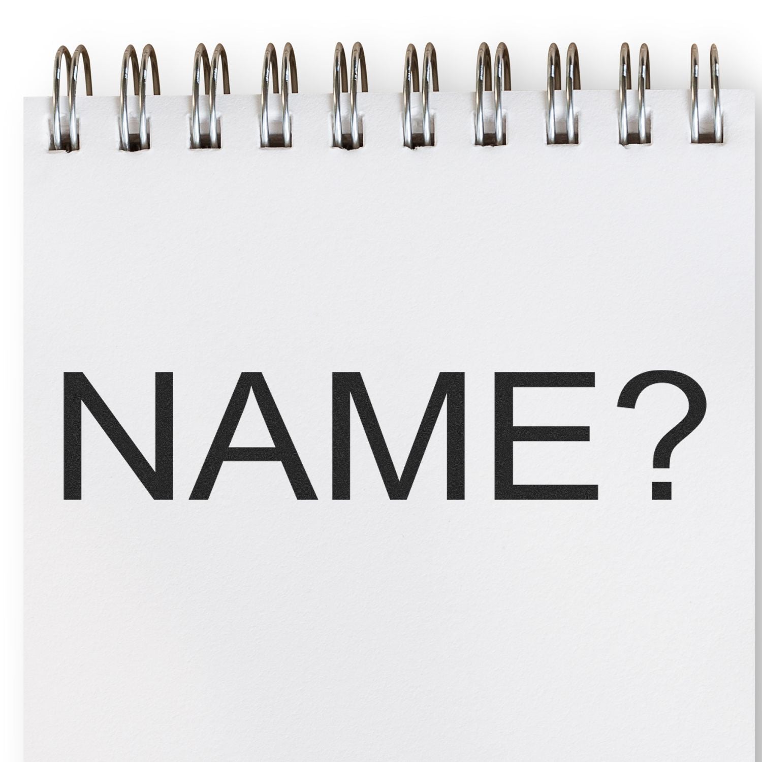 Name question mark and binder clips on white background, representing a request to provide your name in a form or document.