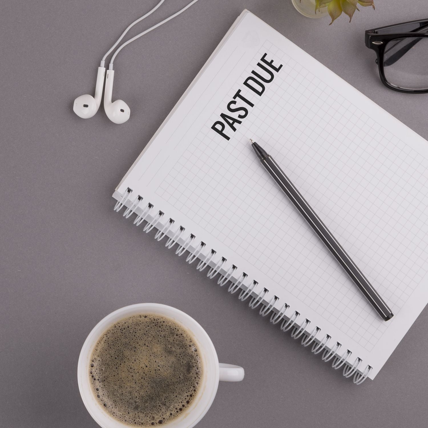 Notebook page labeled FASTING with pen, headphones, and coffee cupwellness planning image for fasting routines