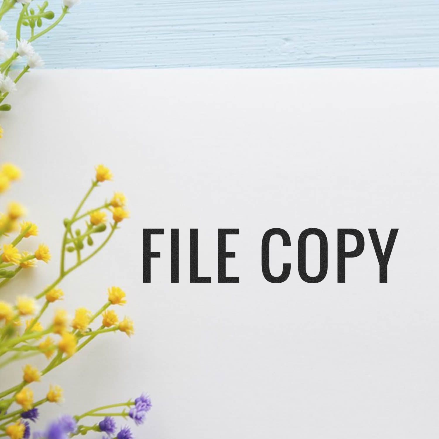 File copy watermark over spring yellow and purple flowers on white background, used as a design preview placeholder for file sharing and branding.
