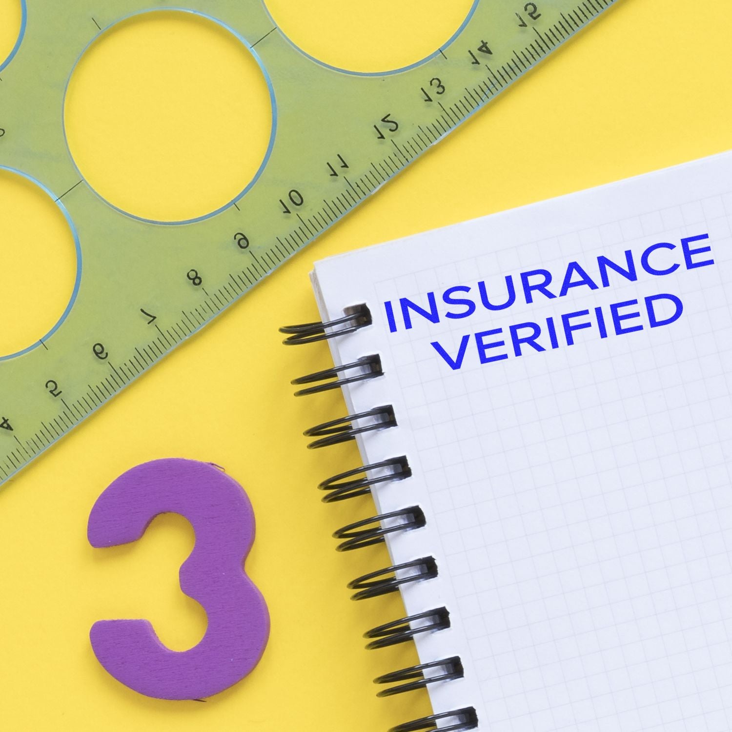 Notebook reading INSURANCE VERIFIED with tape measure and question markinsurance verification concept on bright yellow background.
