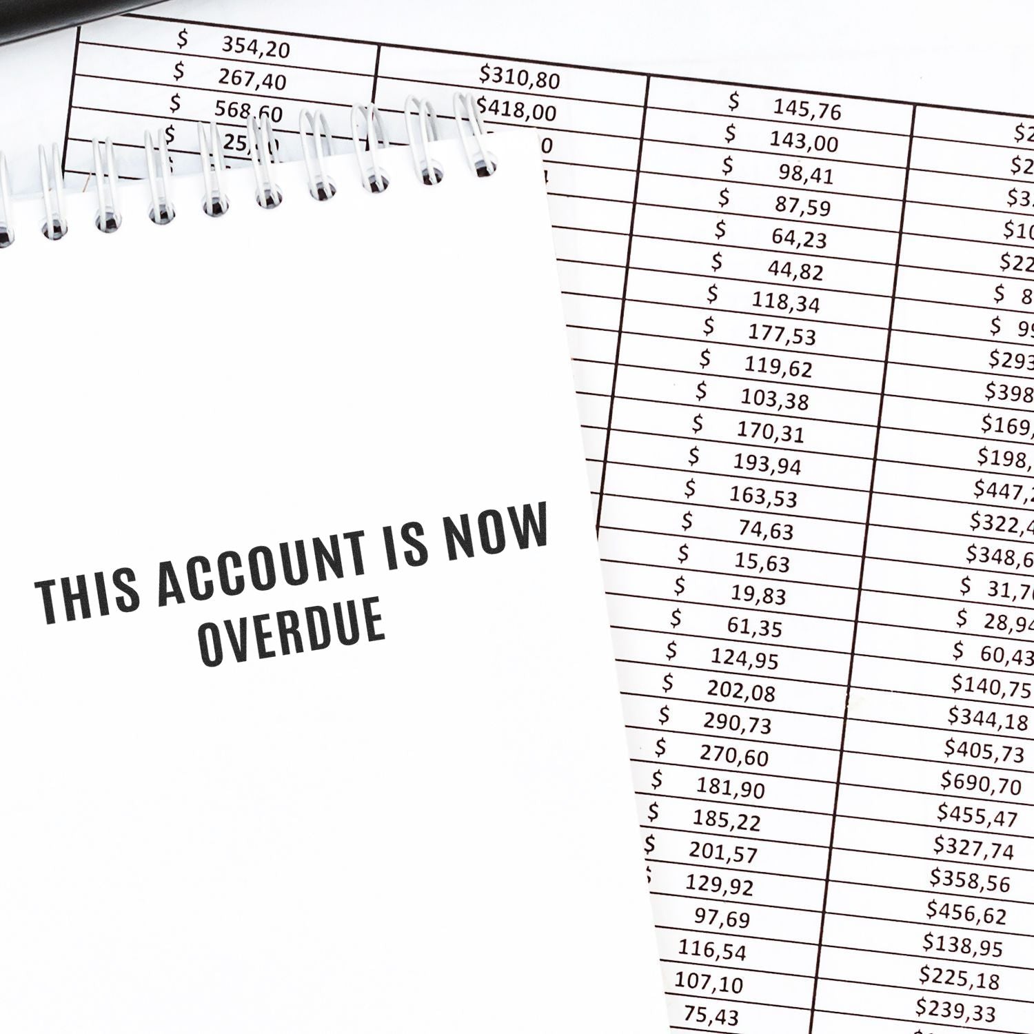 Overdue account notice over an accounting spreadsheet showing dollar payment amounts and overdue balances