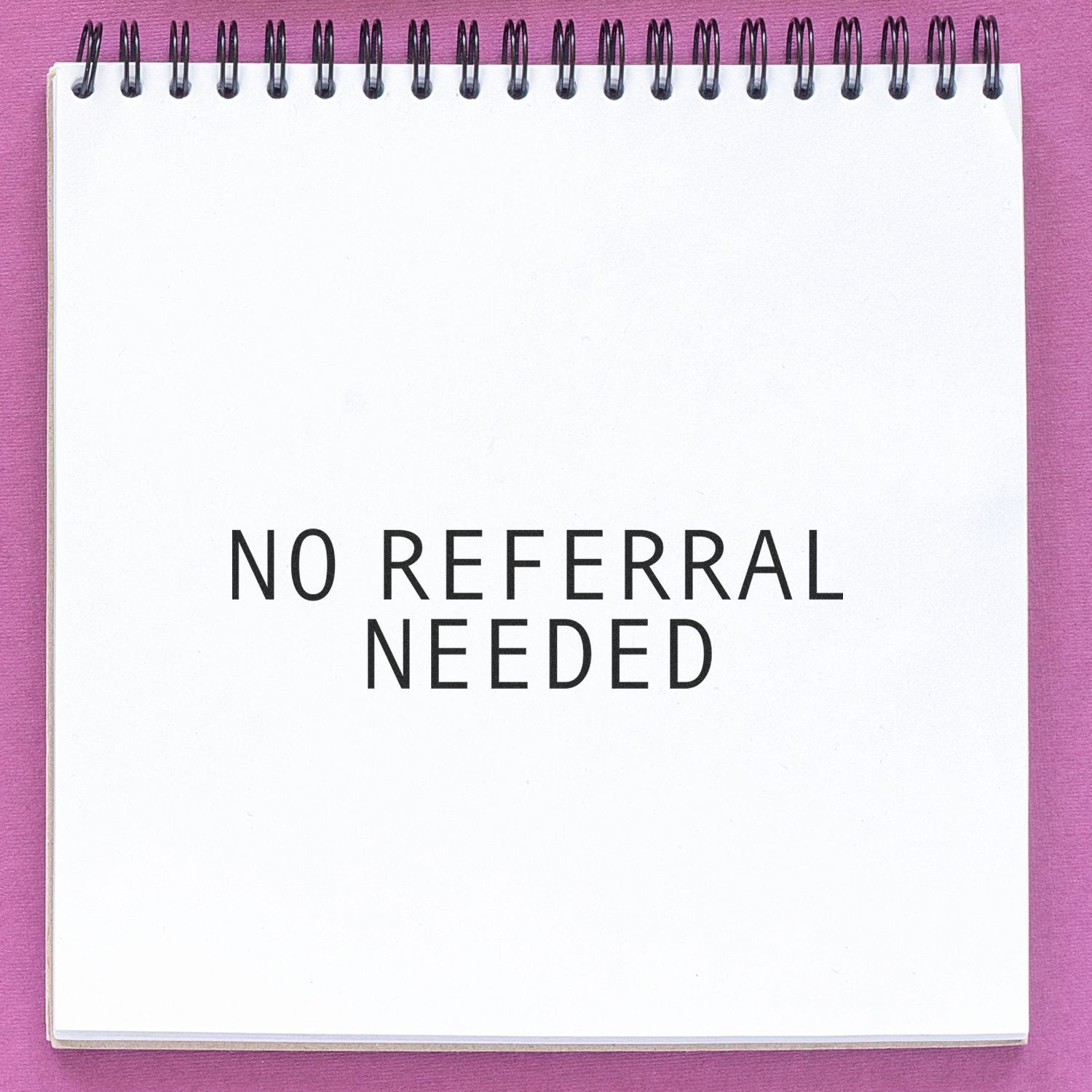 Notebook cover with bold text No Referral Needed on purple background, promoting referral-free marketing or signup messages.