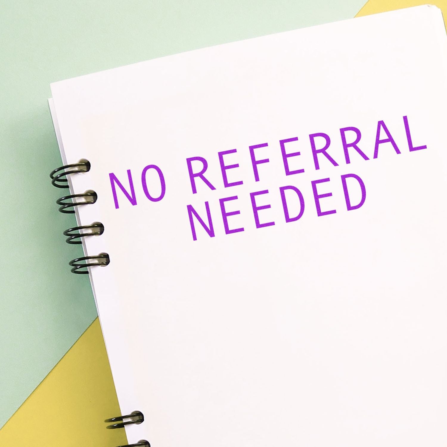 Notebook with No Referral Needed text, highlighting direct access healthcare or service without a referral.
