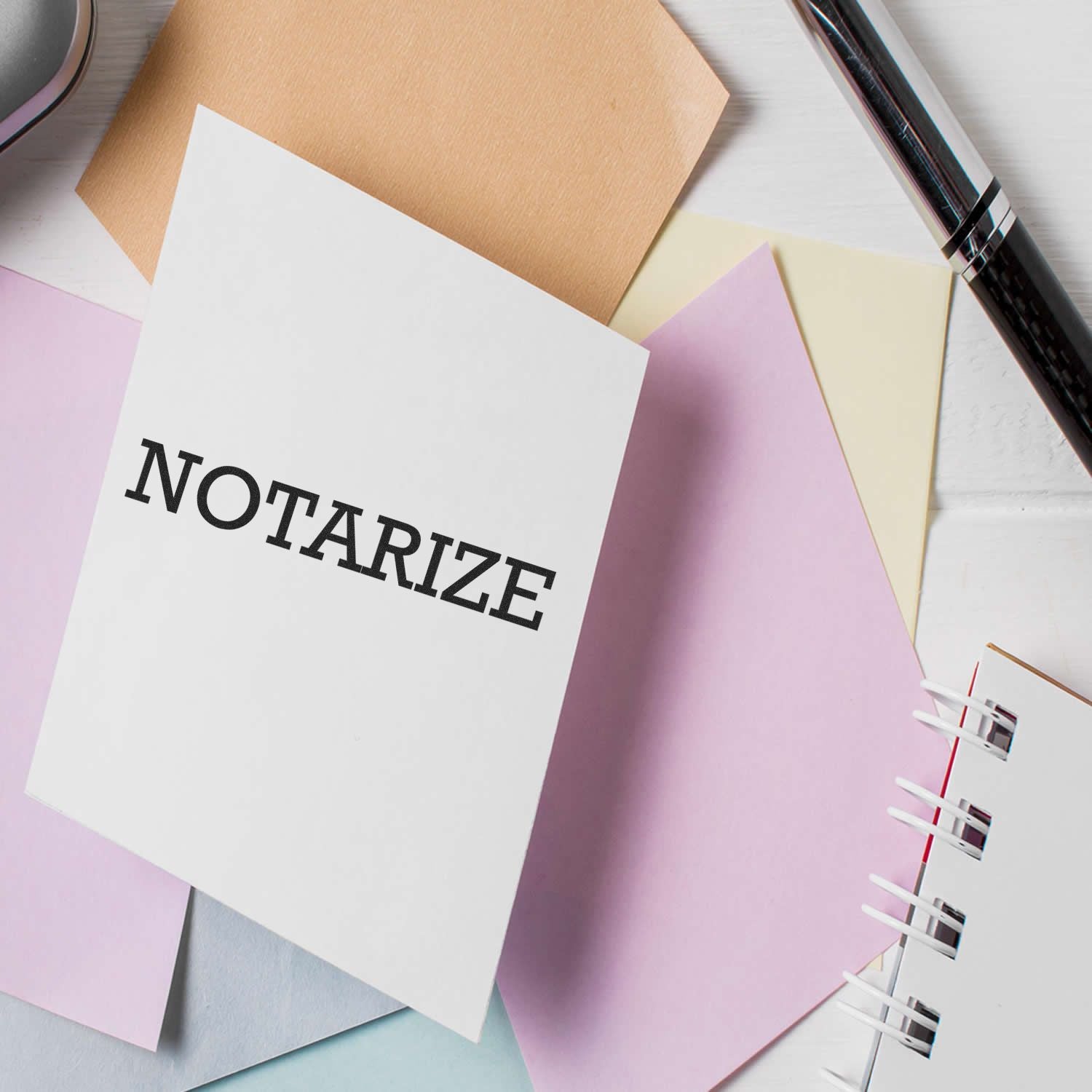 Notarize paperwork concept: notebook and document pages with NOTARIZE title, tools on desk for legal signing