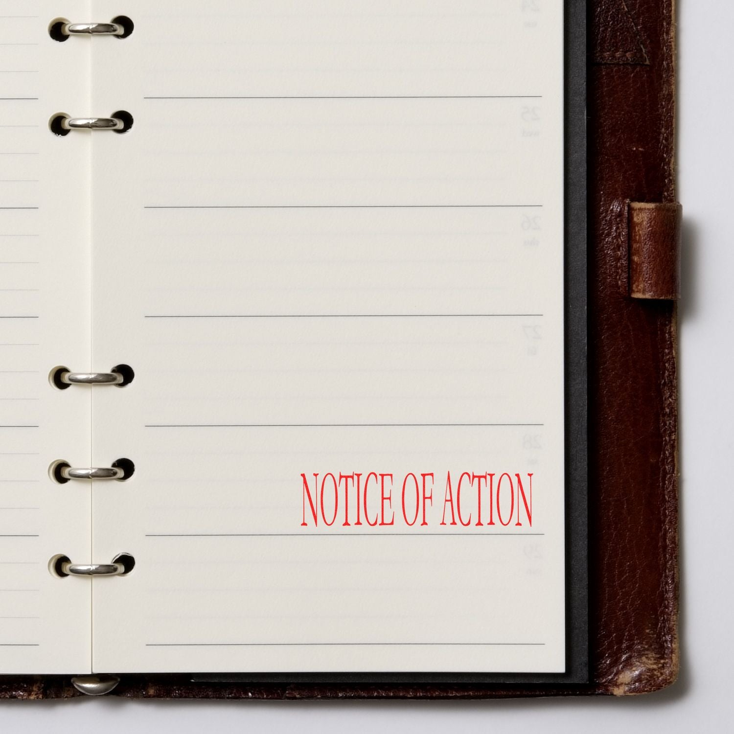 Notice of action document page in a binder with red title text for legal updates and official proceedings.