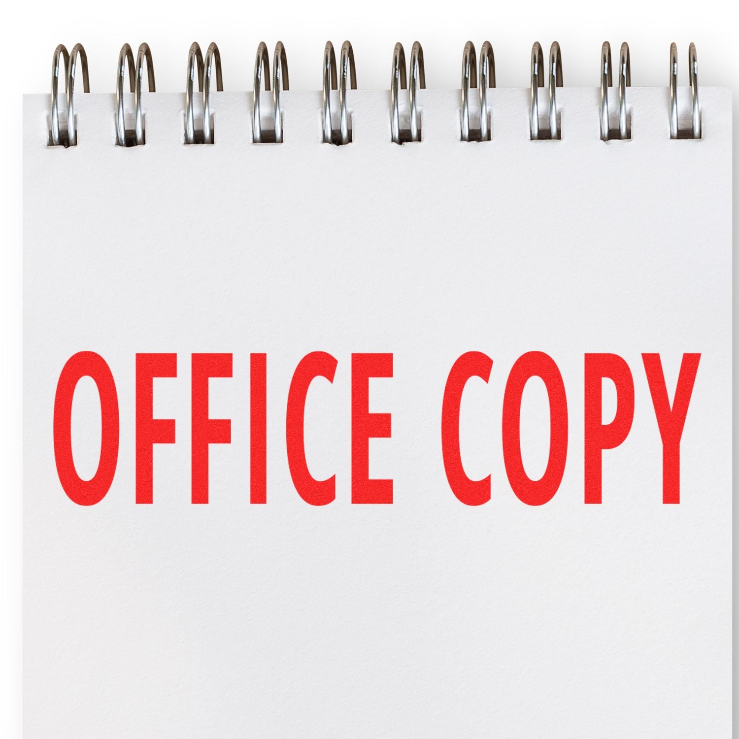 Spiral notebook with red Office Copy text, office stationery and business document concept.
