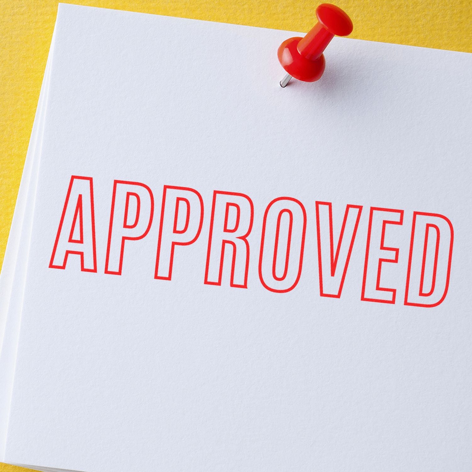 Pushpin pins a document marked APPROVED in red letters, signaling approval, acceptance, and confirmation.