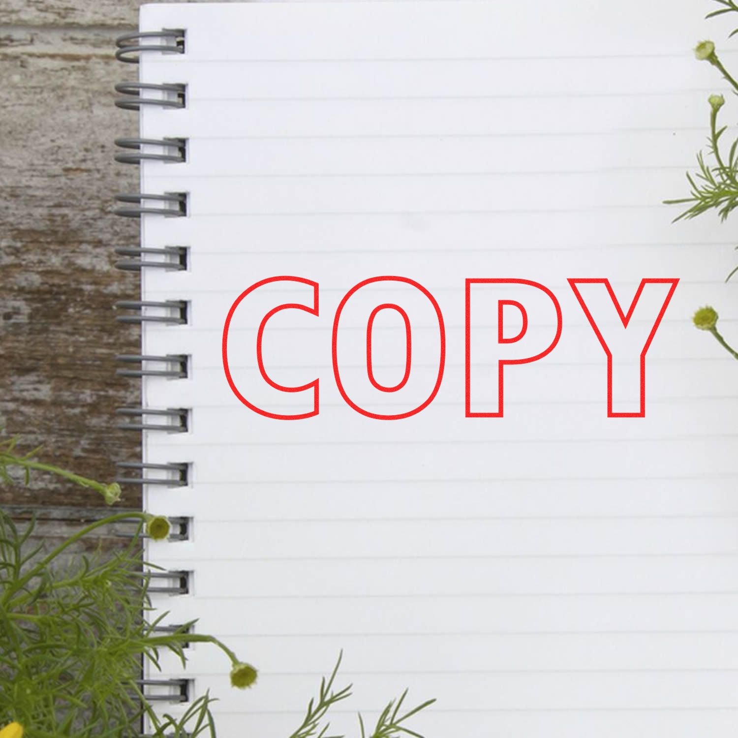 Outdoor white wall sign with bold red COPY lettering for branding and content creation promotion.