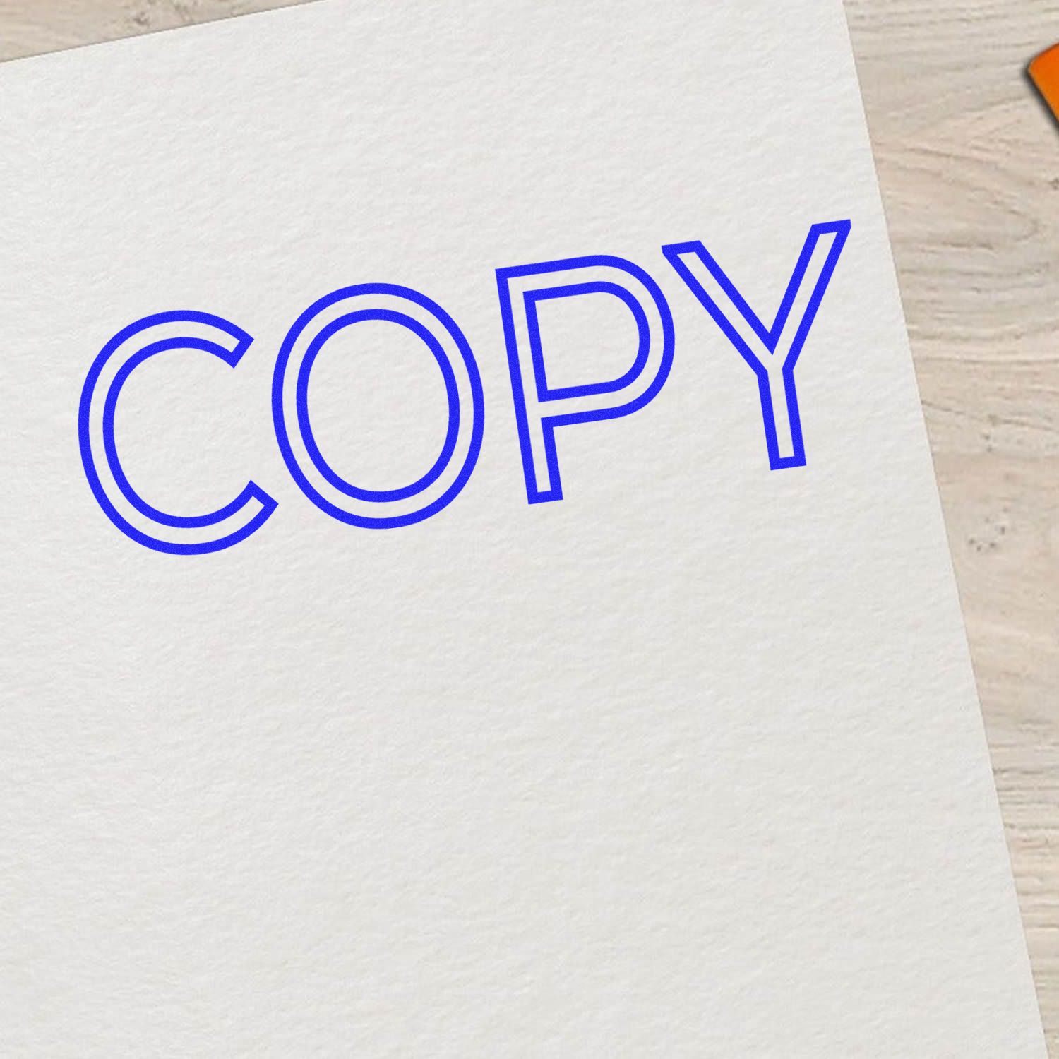 Blue COPY logo printed on a white paper card, branding for a print and copy center marketing materials and office signage stationery.