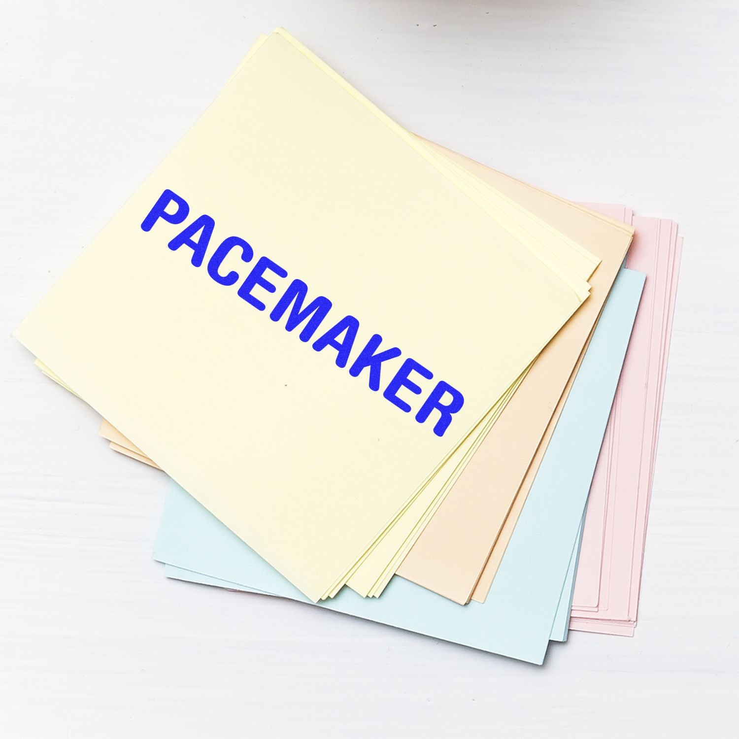 Stack of pastel paper packaging materials labeled PACKAGE for mailing, shipping, and gift wrapping.